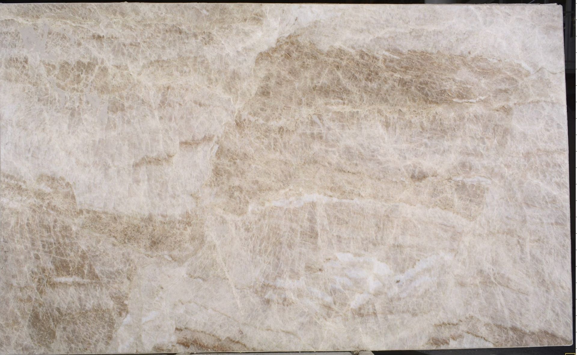 Taj Mahal Quartzite counter tops with subtle veining installed by StoneKing Granite in Lubbock, Texas. 