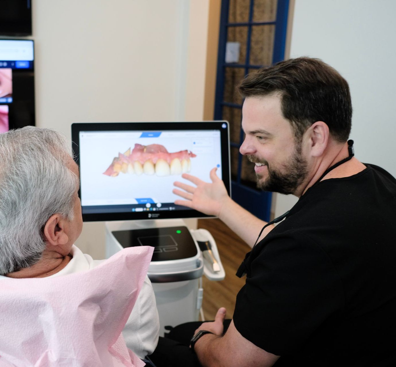 Two people in a counseling session, one speaking and gesturing in a bright office