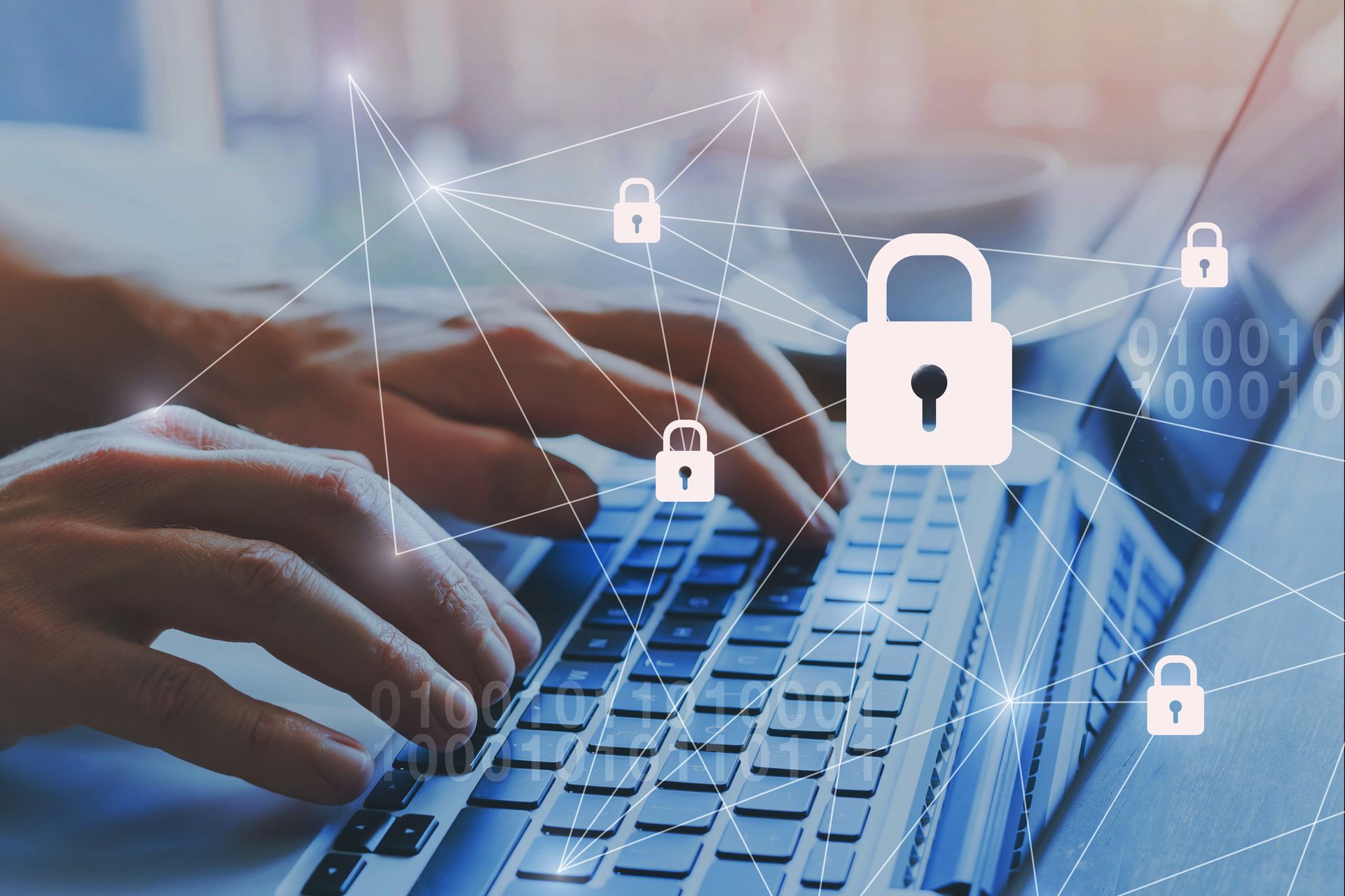 Hands typing on a laptop, overlaid with digital locks and connection lines, representing cybersecurity.