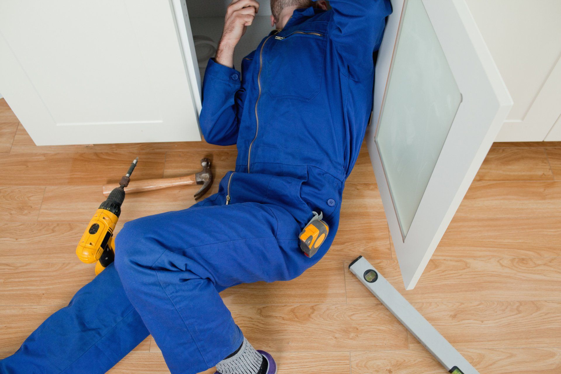 Plumber Fixing Under Sink — El Paso, TX — Sunrise Plumbing Co.