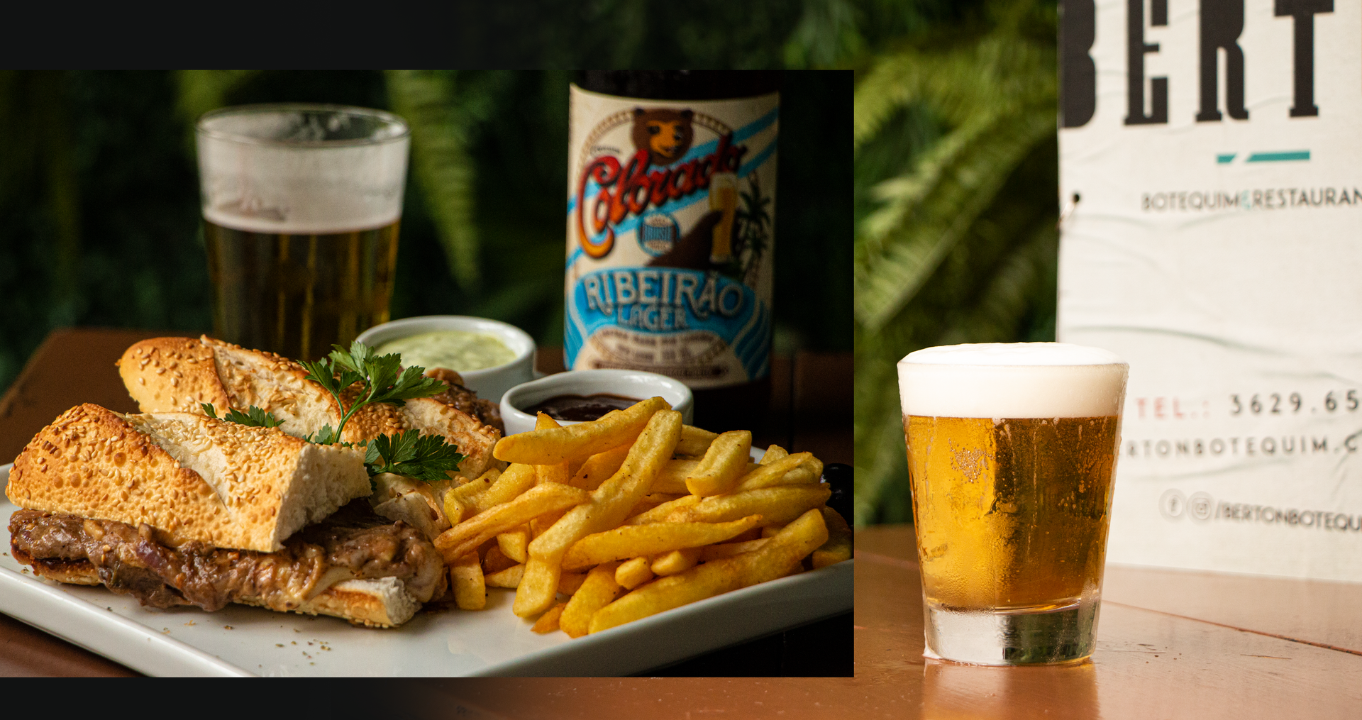 Um prato de comida e um copo de cerveja em uma mesa.