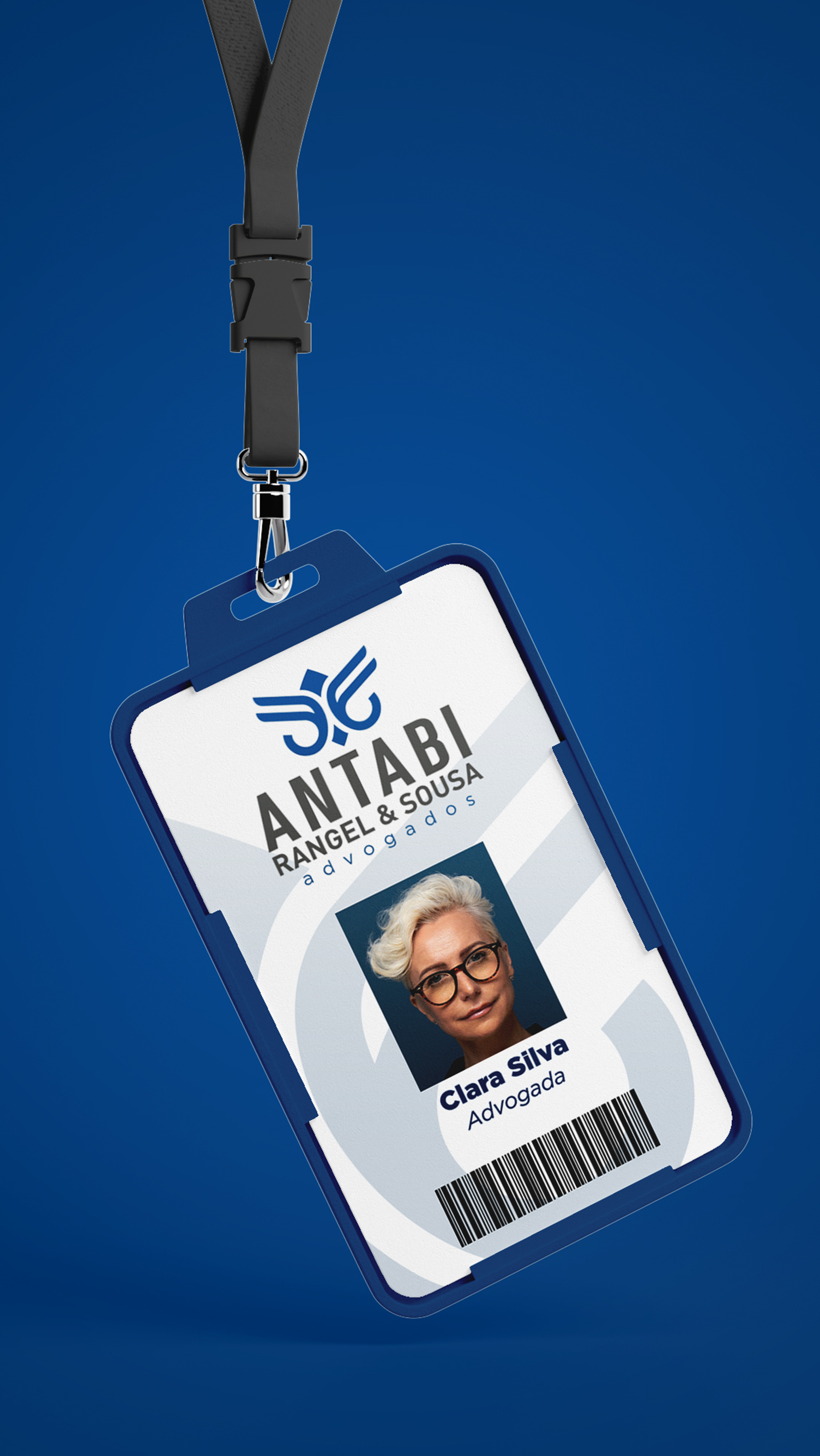 Antabi, Rangel, Sousa, & Goes An id card with a picture of a woman on it is hanging on a lanyard.