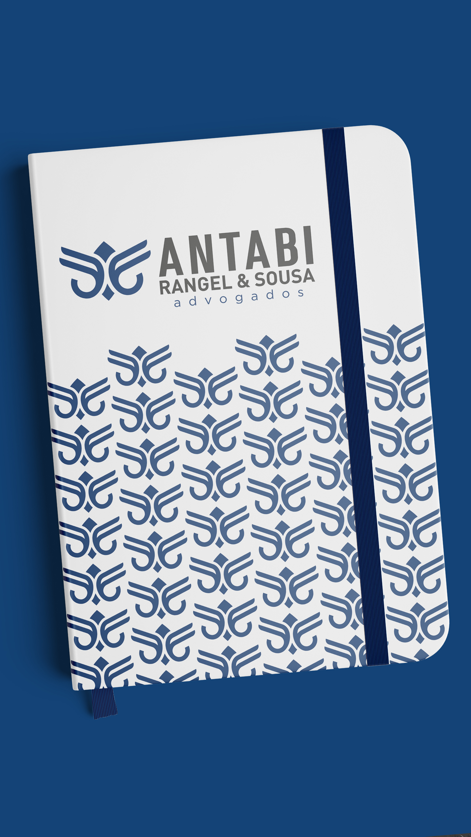 Antabi, Rangel, Sousa, & Goes A notebook with a blue and white pattern on it is sitting on a blue surface.