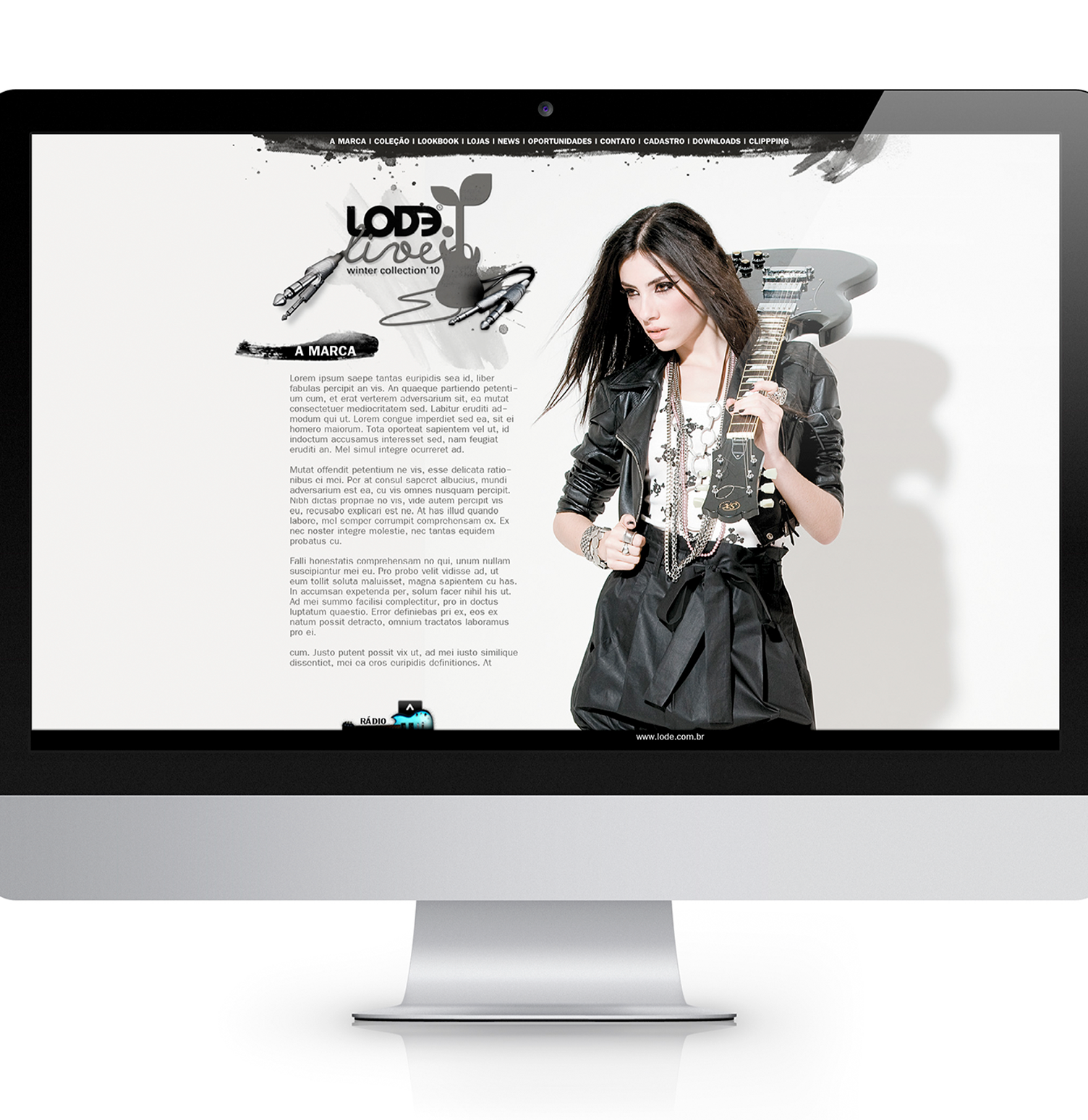 A computer monitor with a woman holding a guitar on the screen