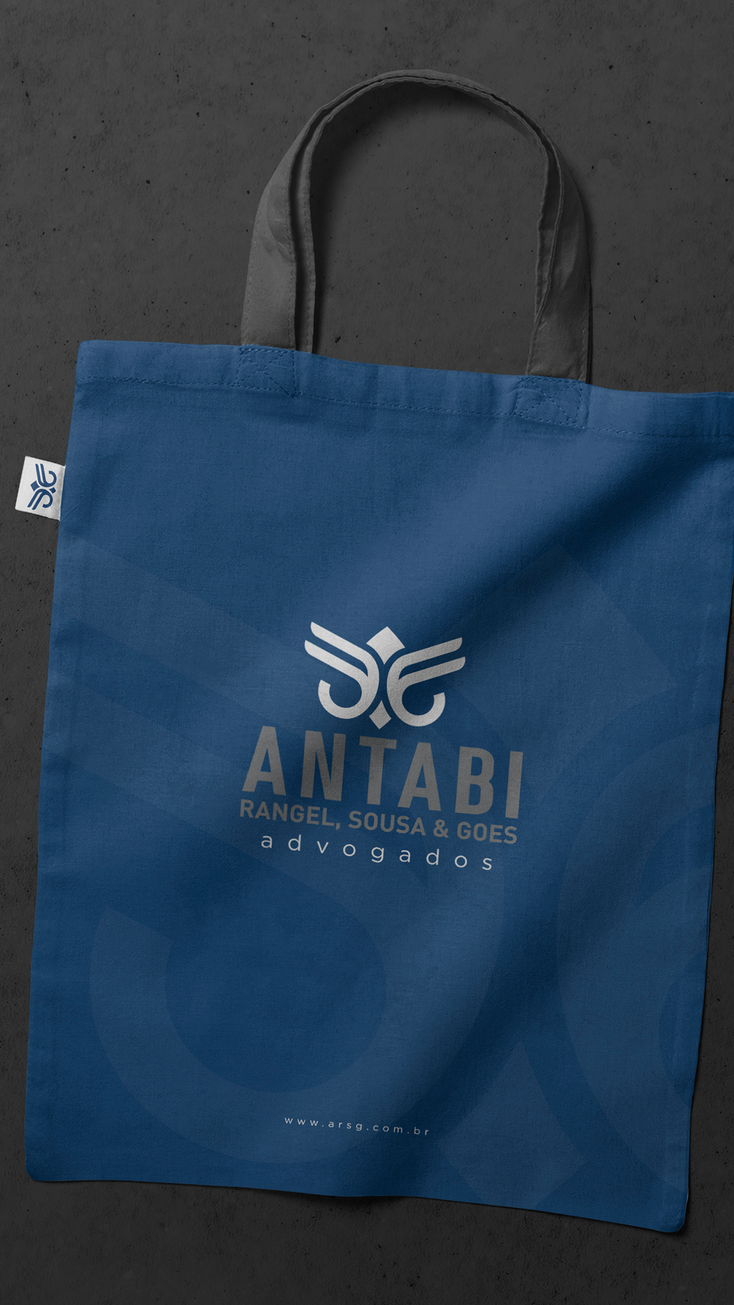 Antabi, Rangel, Sousa, & Goes A blue tote bag with the word antabi on it