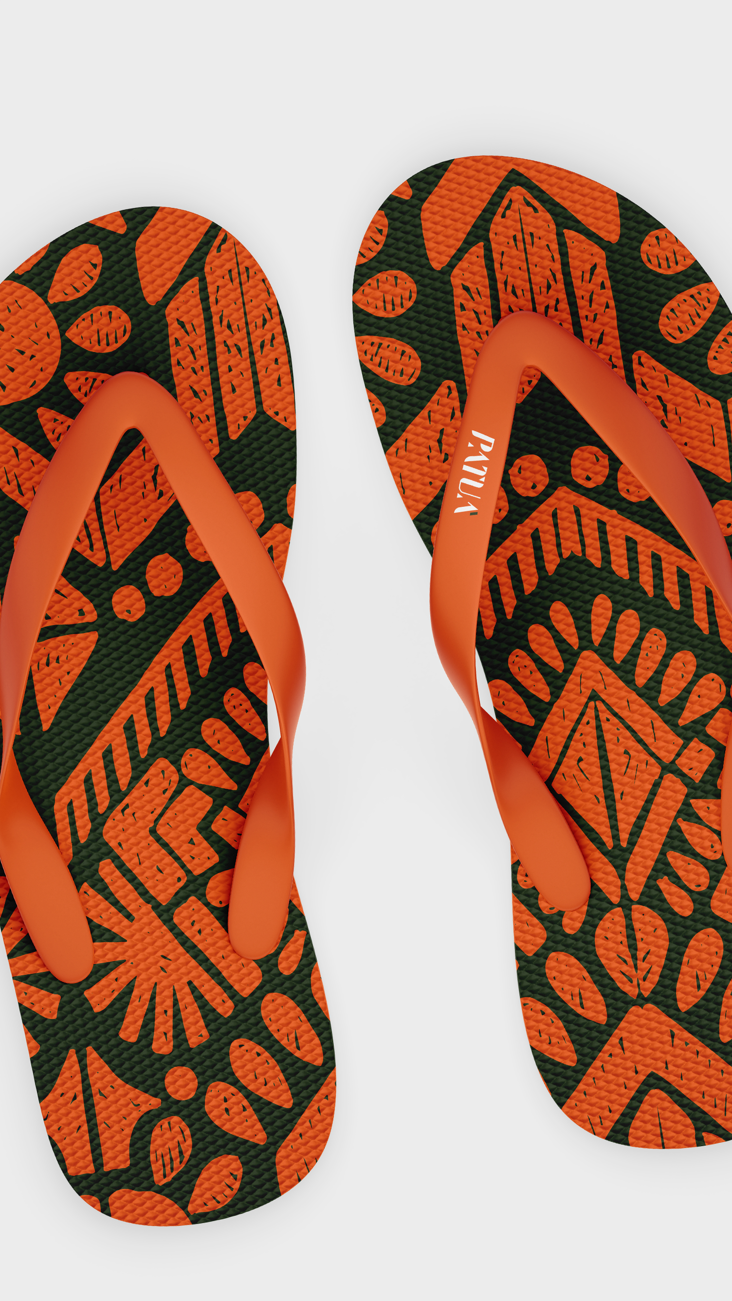 PATUÁ A pair of orange and green flip flops with a pattern on them.