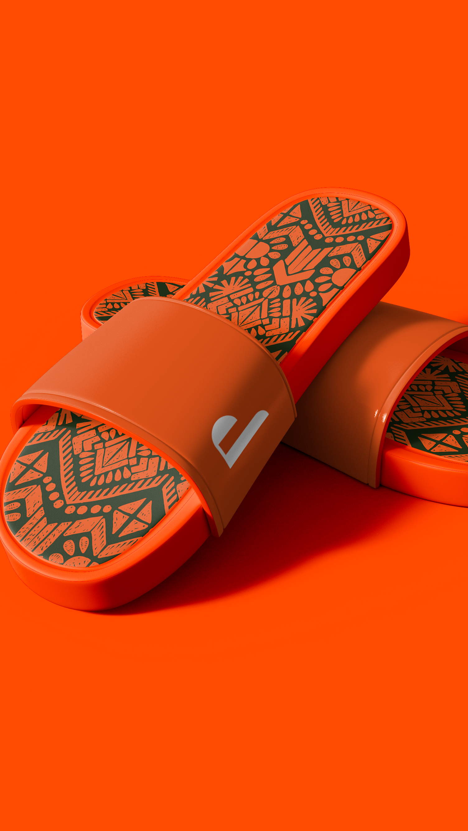PATUÁ A pair of orange sandals are sitting on top of each other on an orange surface.