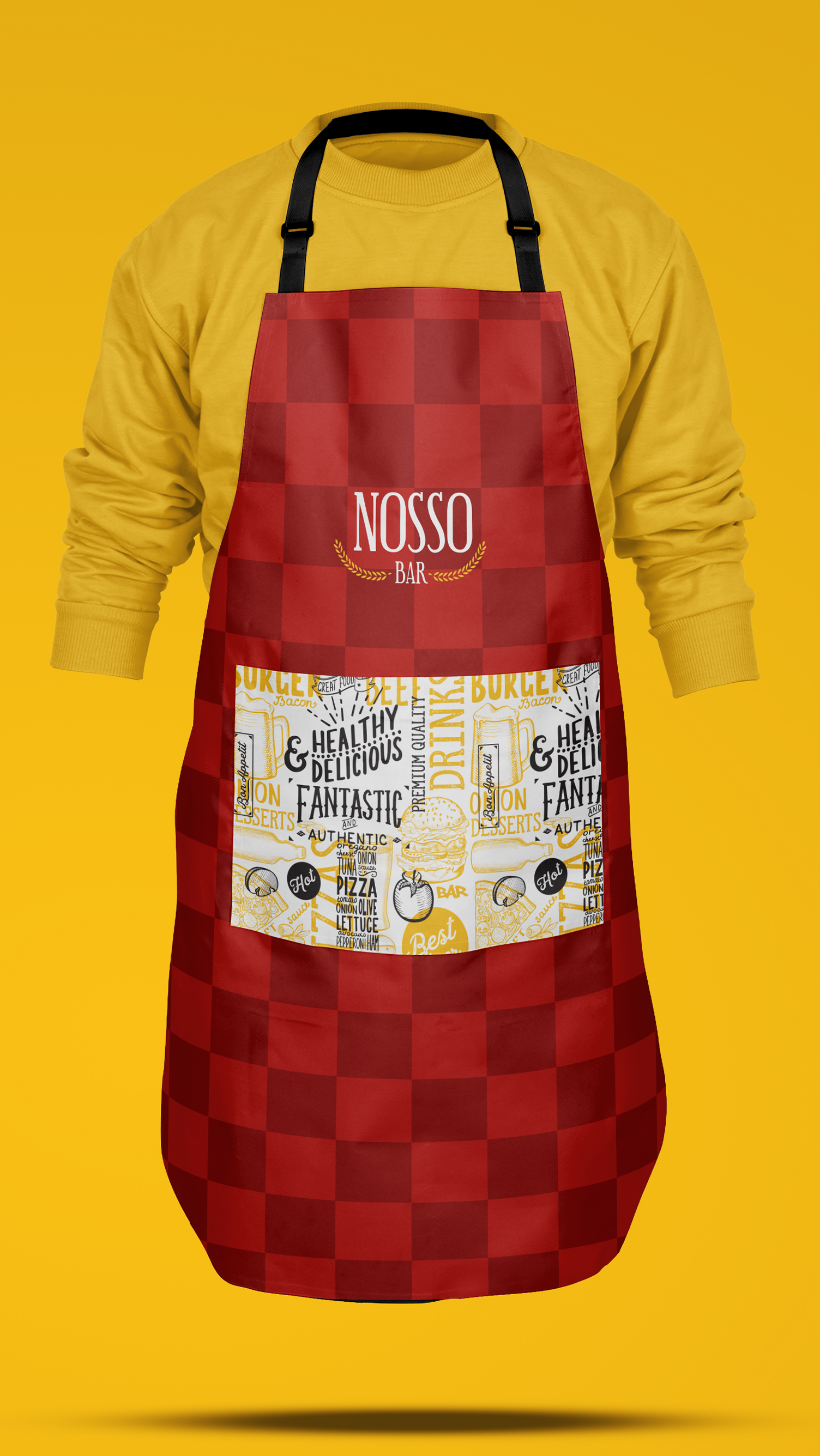 A red apron is on a yellow shirt on a yellow background.