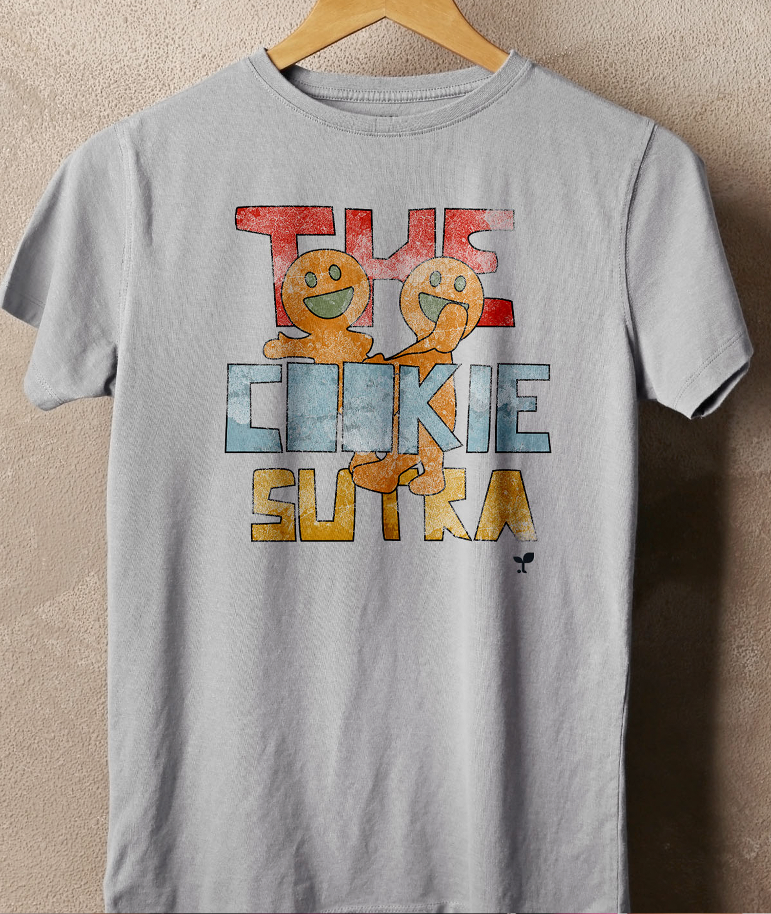 A t-shirt that says the cookie sutra is hanging on a hanger