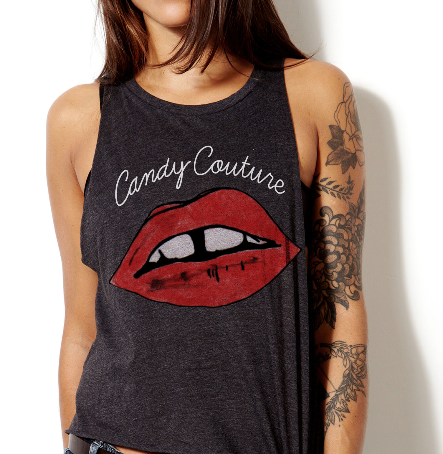 A woman is wearing a candy couture tank top