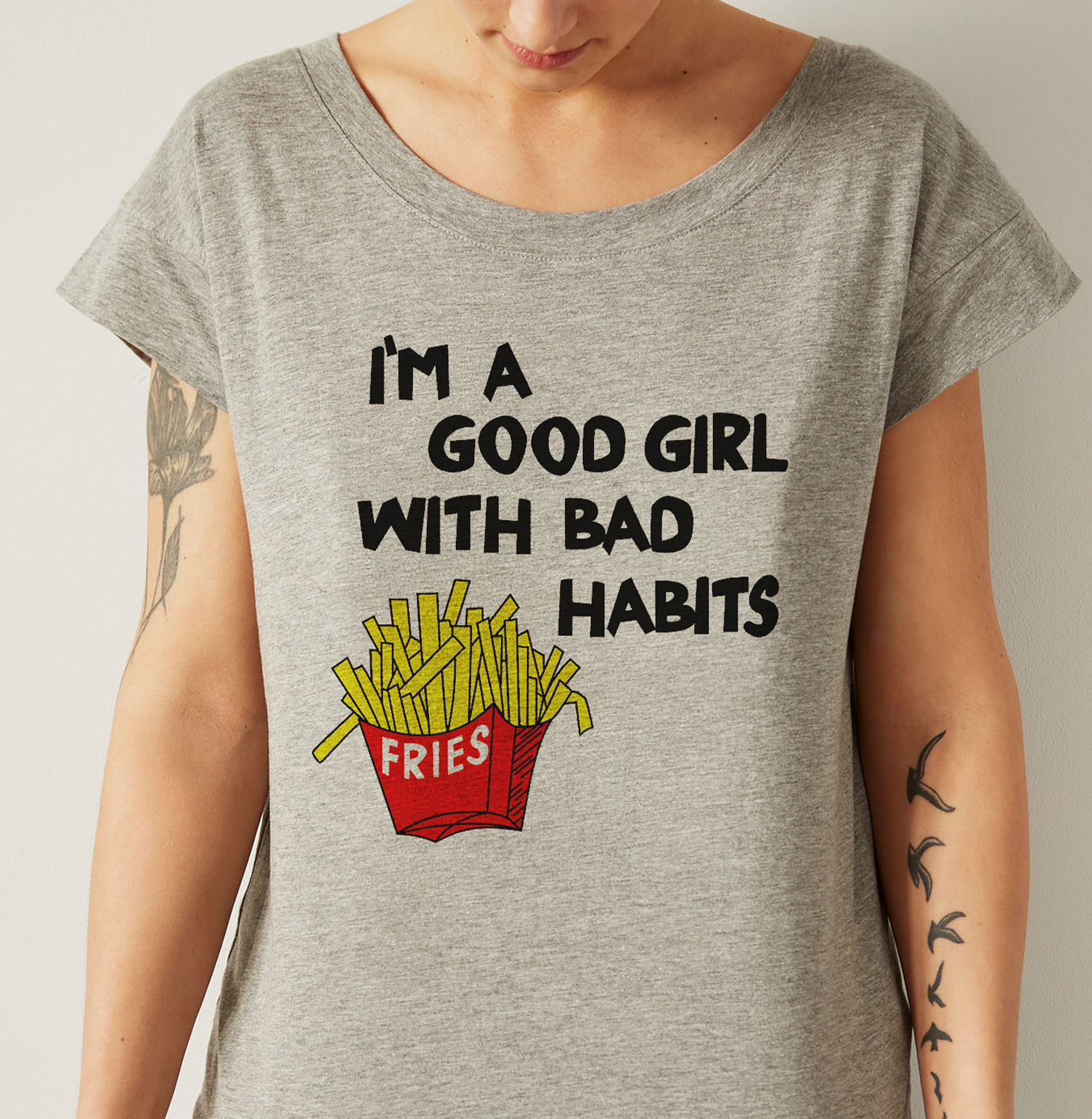 A woman is wearing a t-shirt that says i 'm a good girl with bad habits