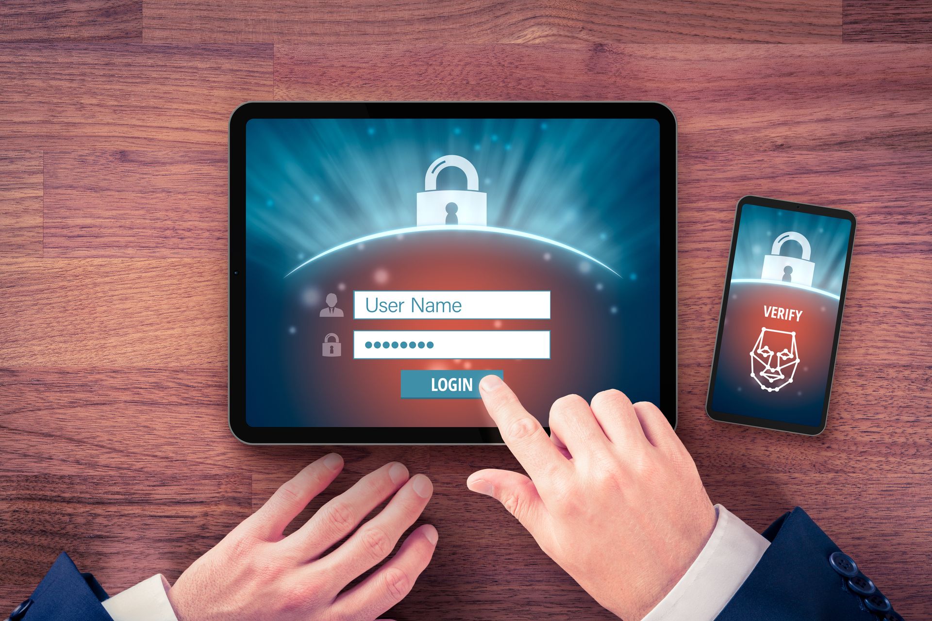 Uma pessoa está usando um tablet e um celular para fazer login em um site.