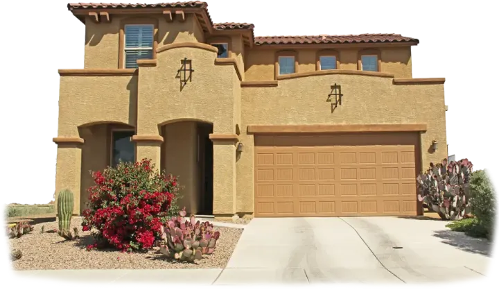 Tan stucco two-story home with a tan garage door, set in a desert landscape. Tan stucco two-story home with a tan garage door, set in a desert landscape.