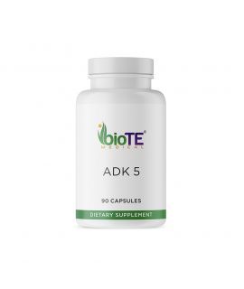 White bottle of Biote Medical ADK 5 capsules. The label features the brand logo, product name, and information about the dietary supplement.