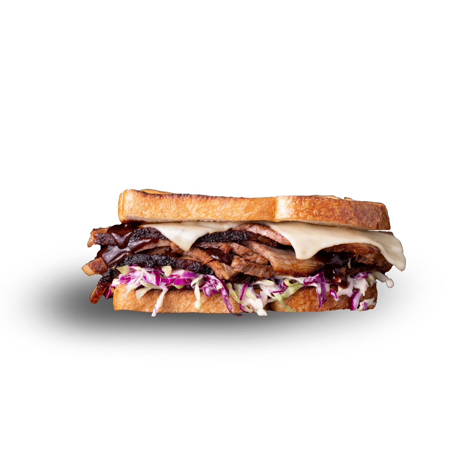 A brisket sandwich on toasted bread with melted white cheese and purple cabbage slaw, isolated on a white background.