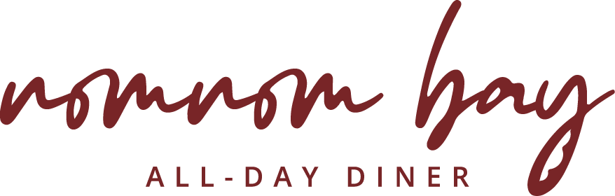 Nomnom Bay All-Day Diner logo in dark red script font on white background.