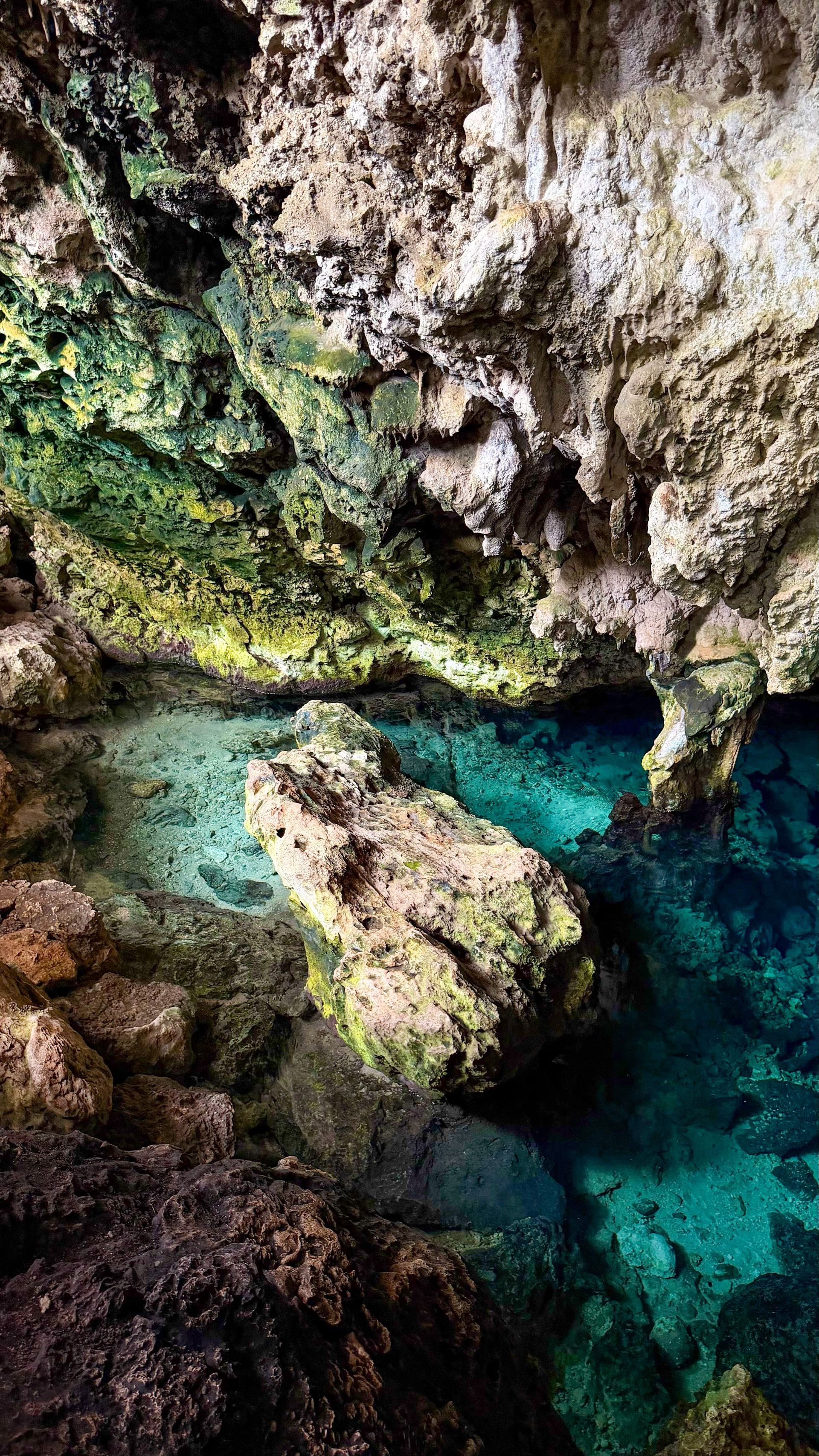 There is a large body of water in the middle of a cave.