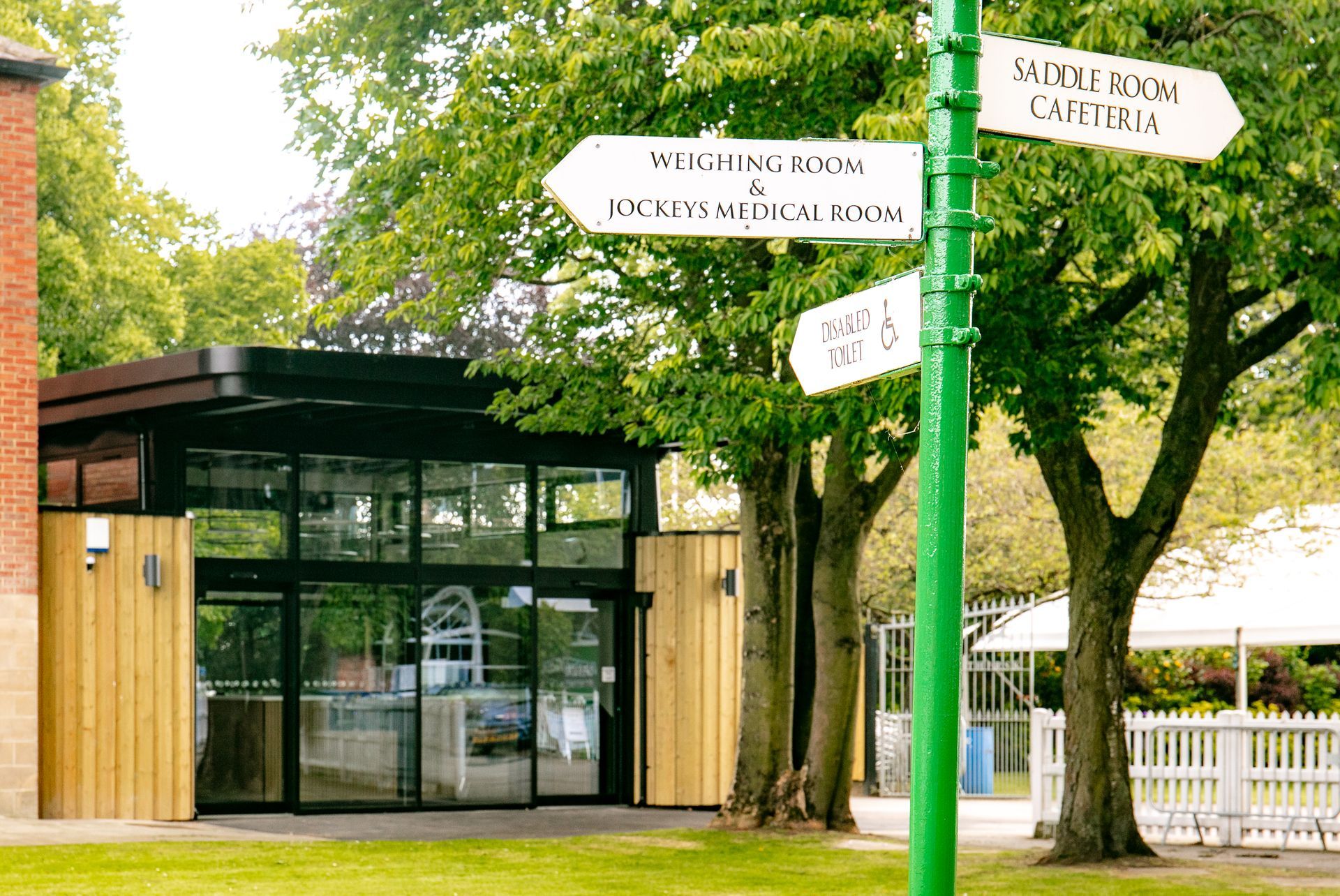 A green pole with a sign on it that says ' salvation room ' on it