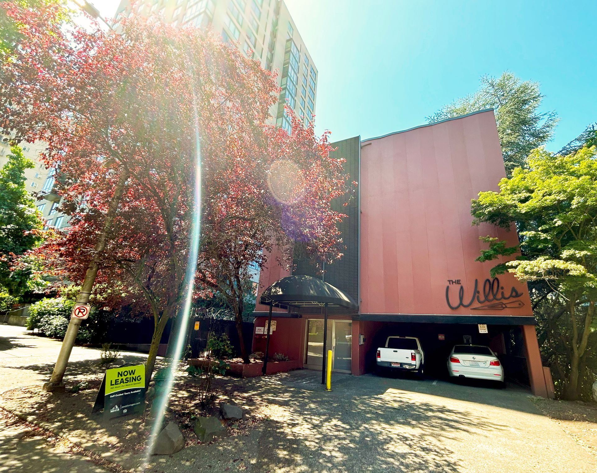 A red building with the word alla on it