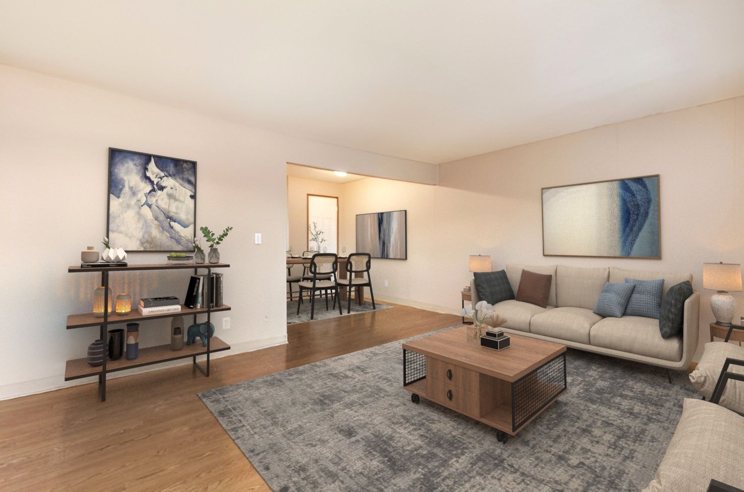 A living room with a couch , coffee table , and rug.