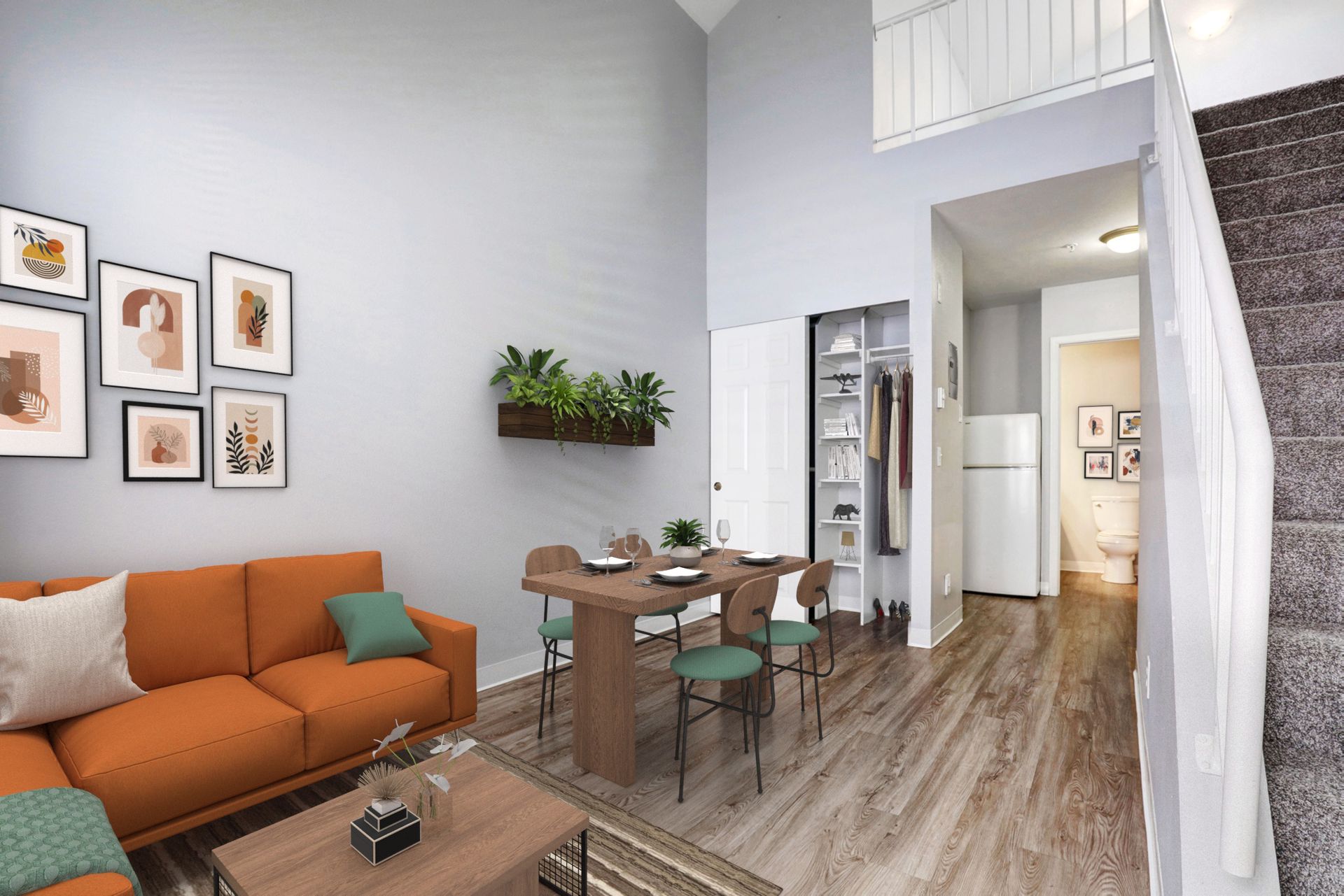 A living room with an orange couch and a wooden table and chairs.