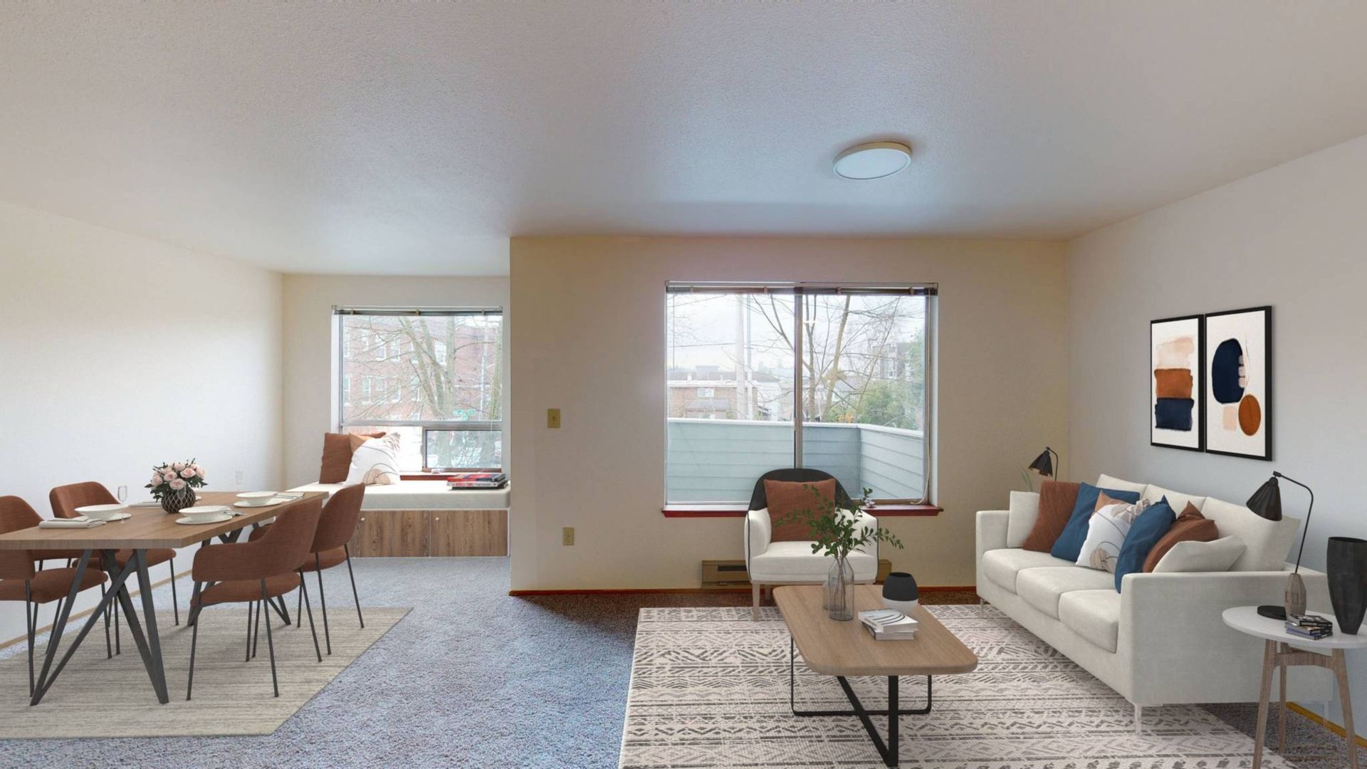 A living room with a couch , table , chairs and a balcony.