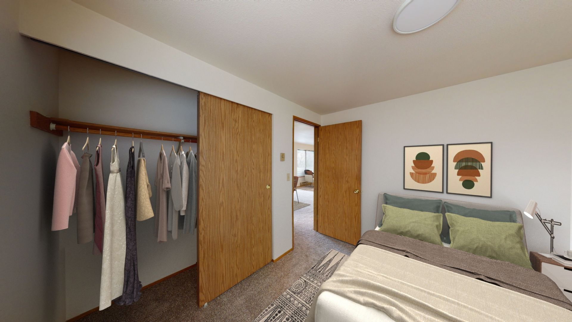 A bedroom with a large closet and a bed.