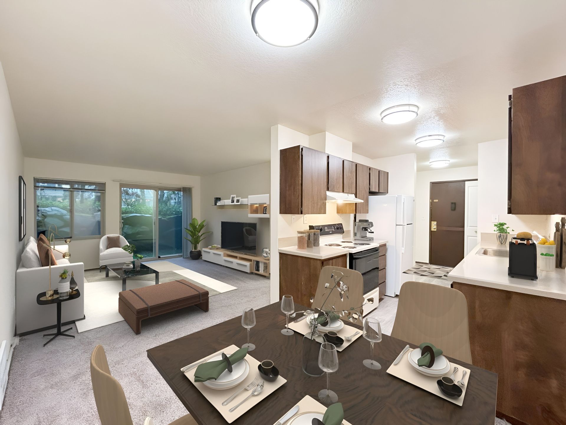 A living room with a dining table and chairs and a kitchen