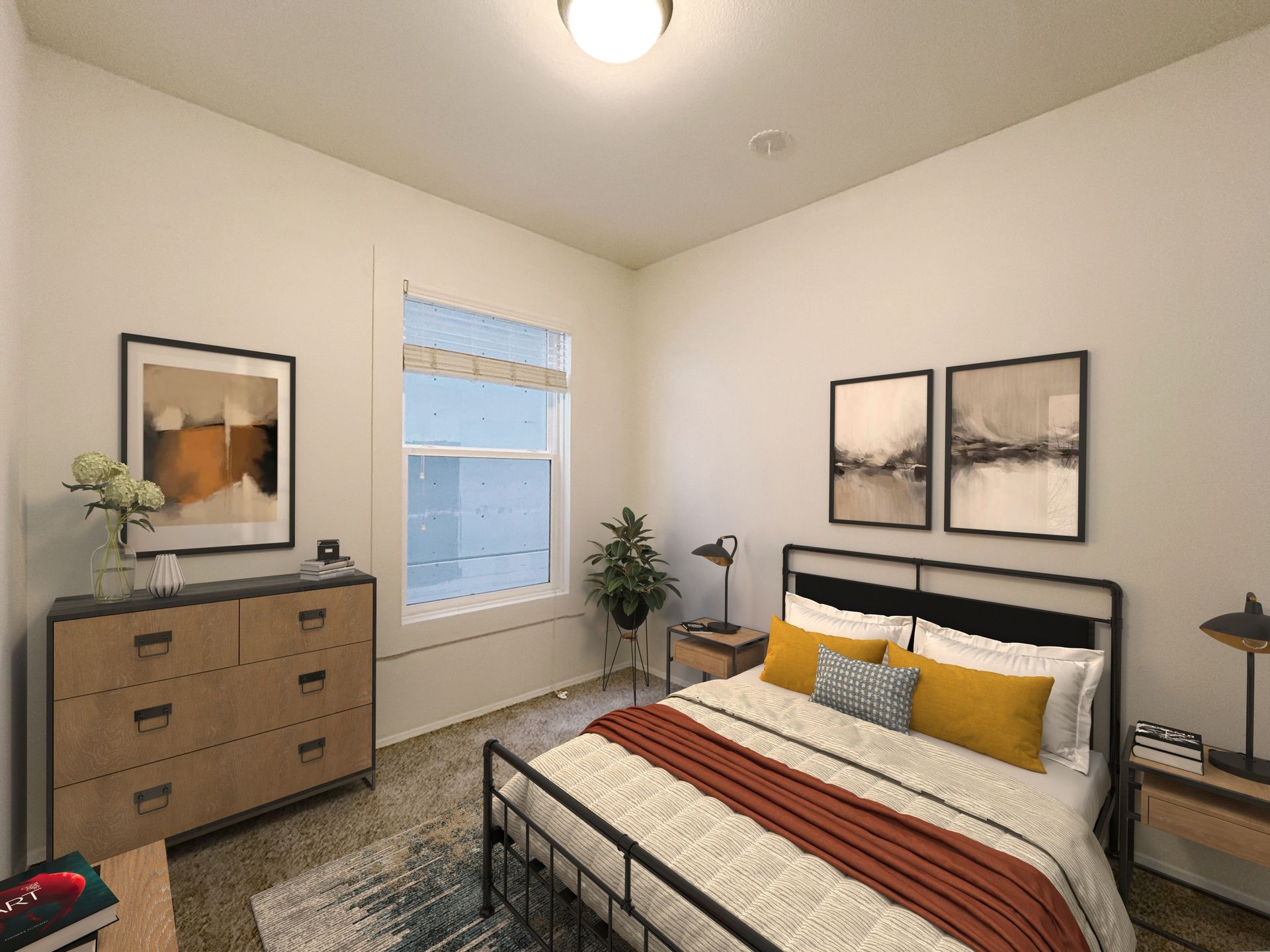 A bedroom with a bed , dresser , nightstand , and window.