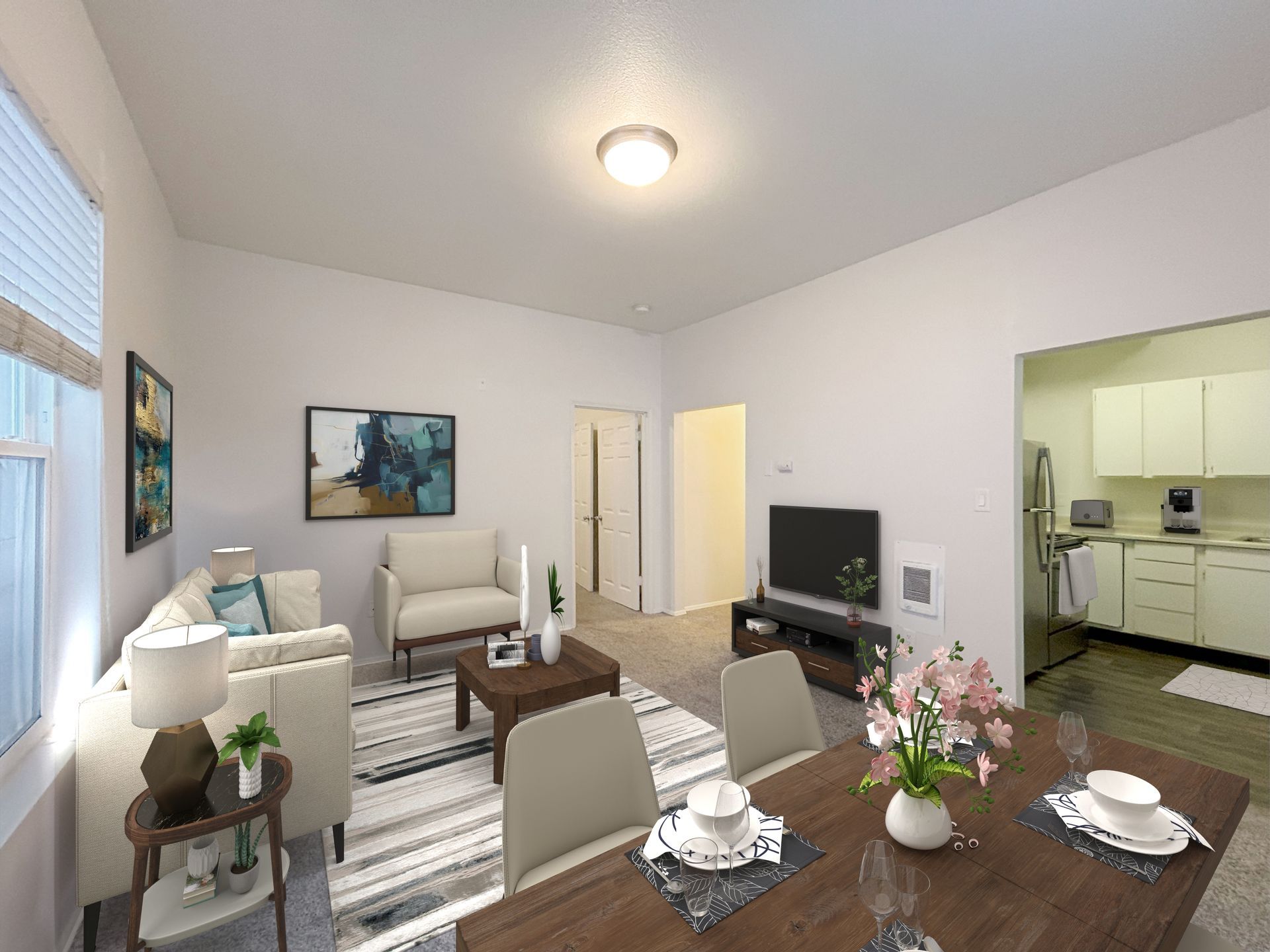 A living room with a dining table and chairs and a television.