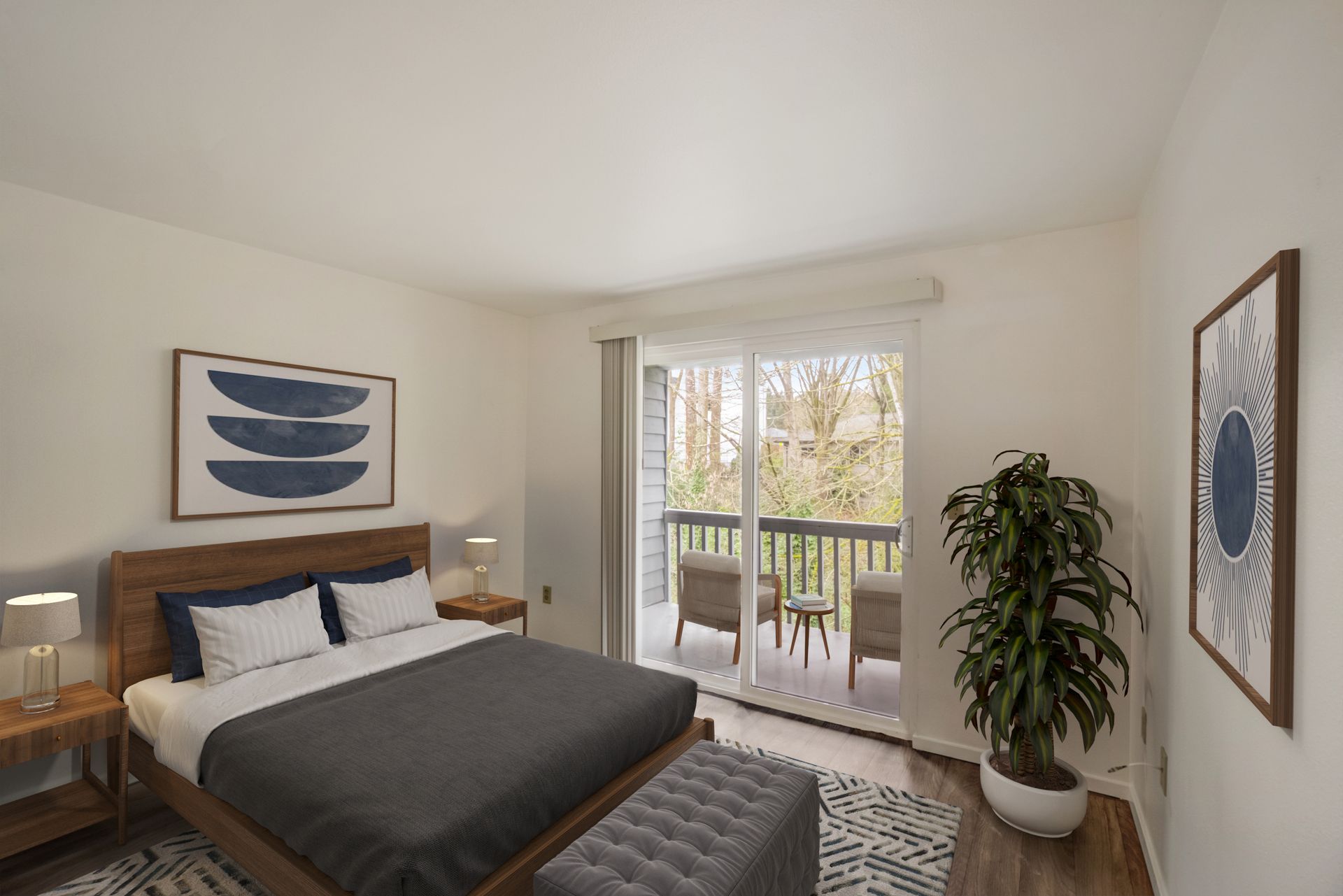 A bedroom with a large bed and a balcony.