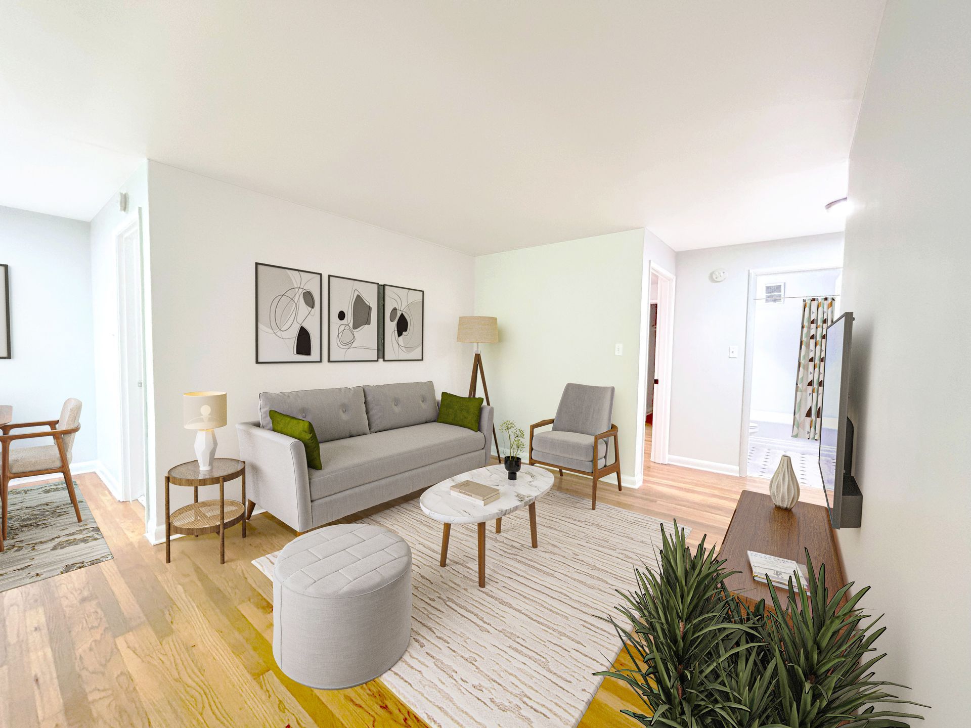 A kitchen , living room , and bedroom in a small apartment.