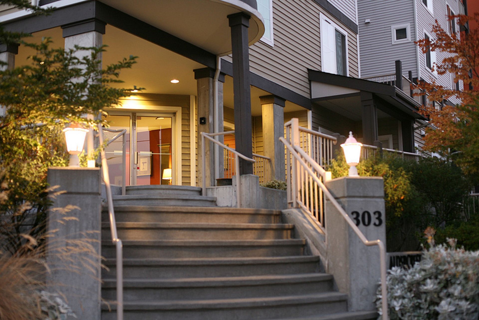 Stairs leading up to a building with the number 303 on it