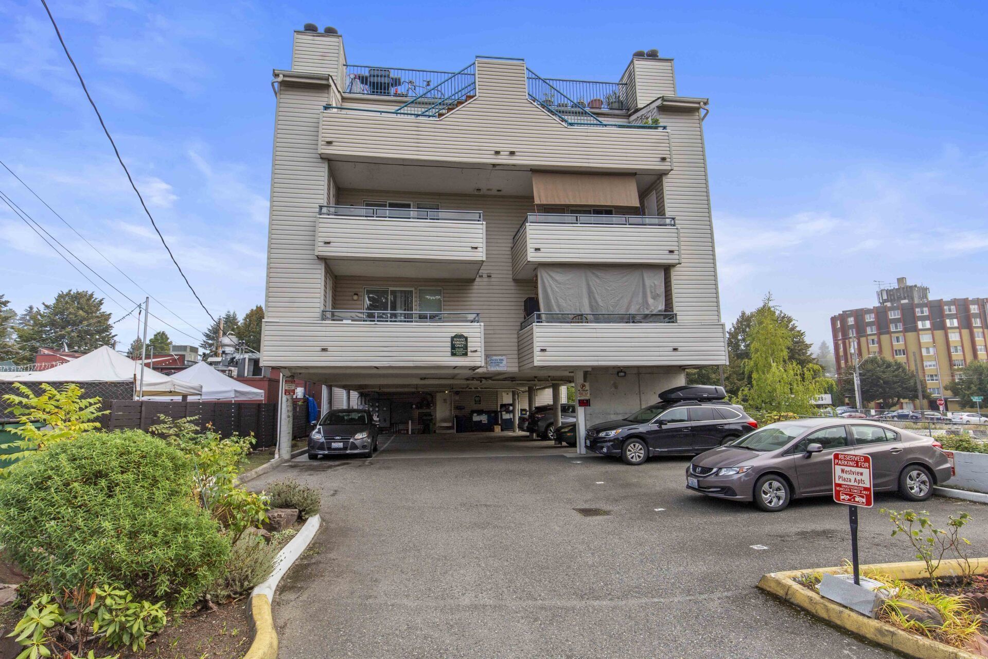 A building with a lot of cars parked in front of it