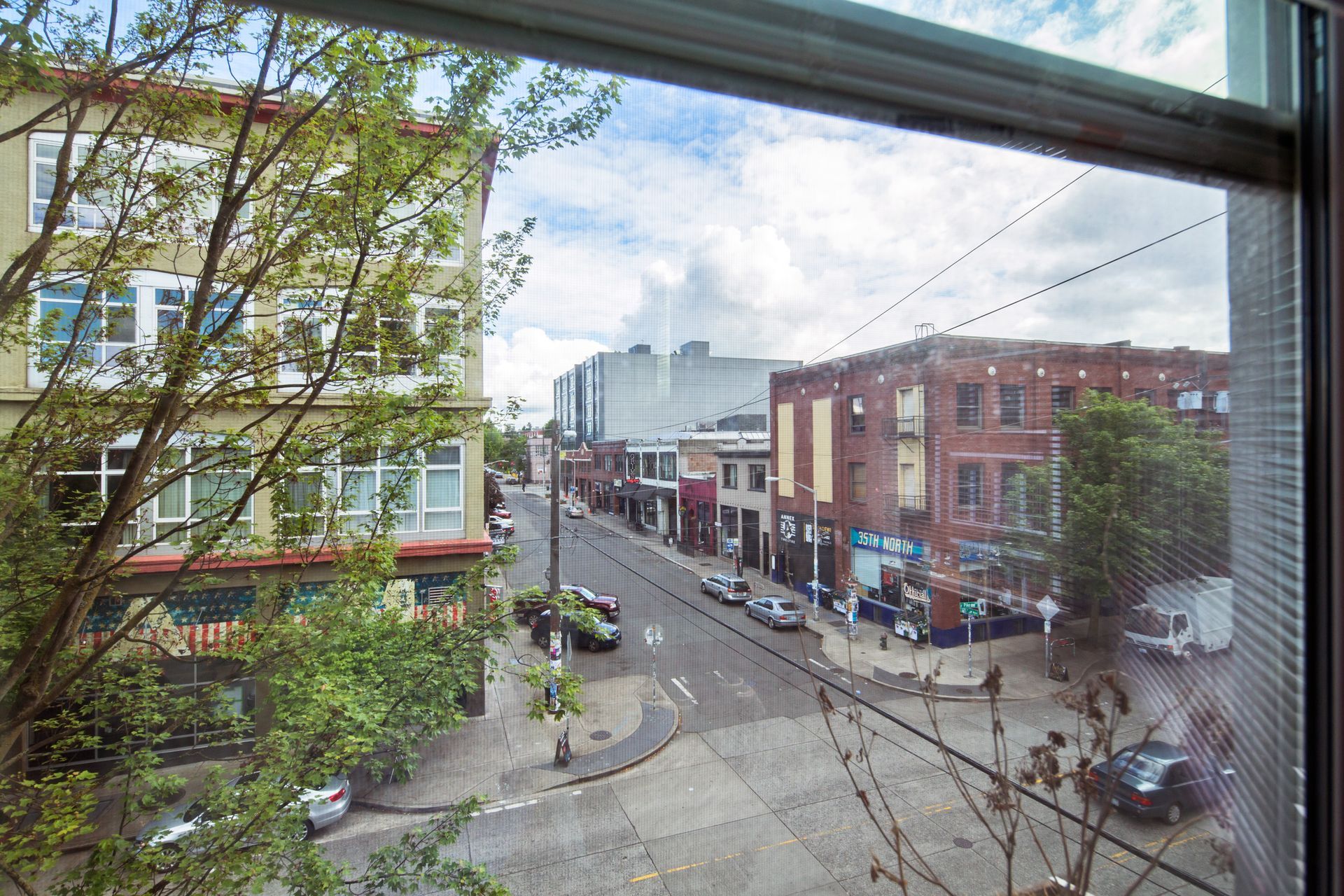 A view of a city street through a window.