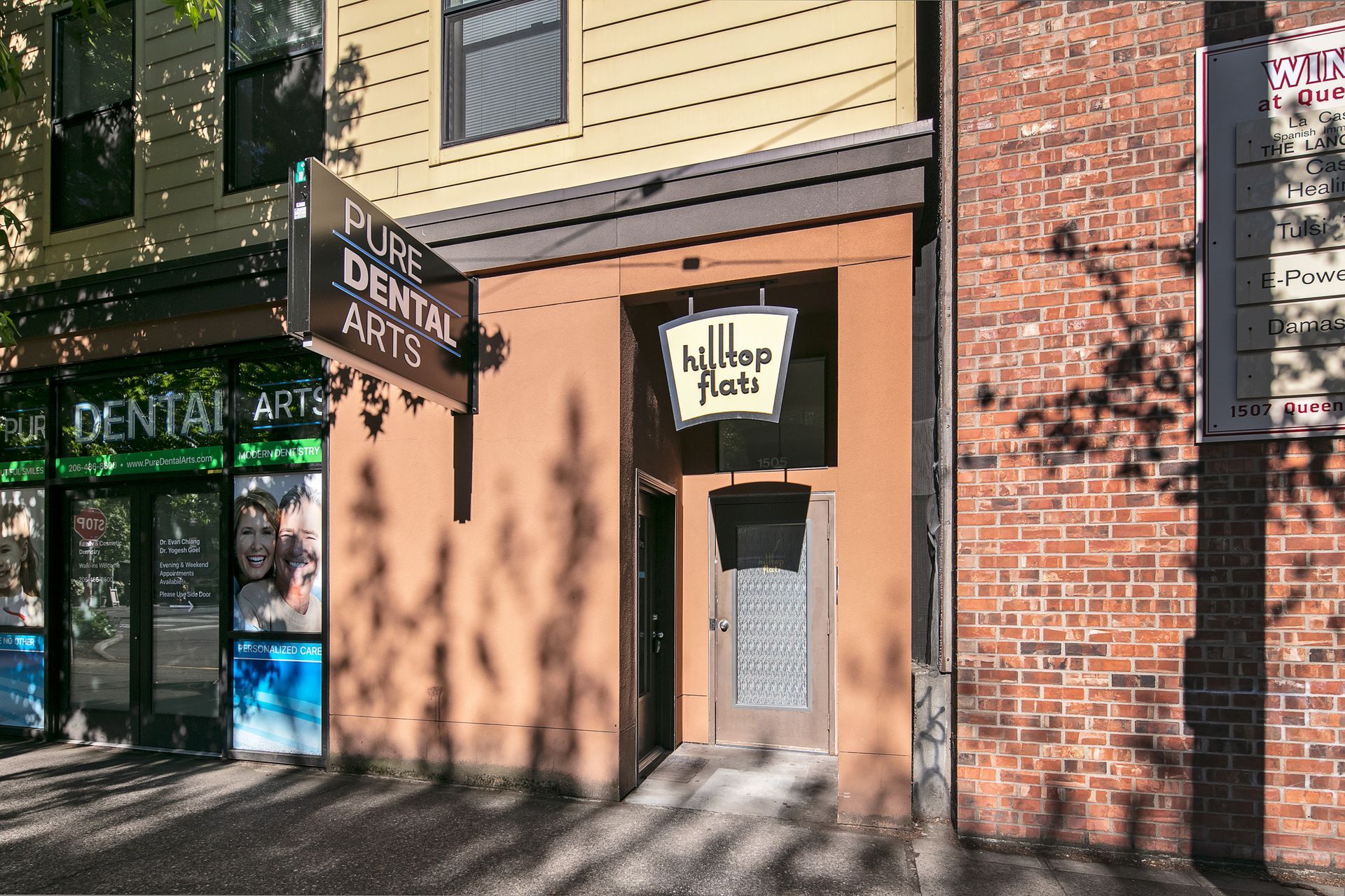 A brick building with a sign that says fine dental arts