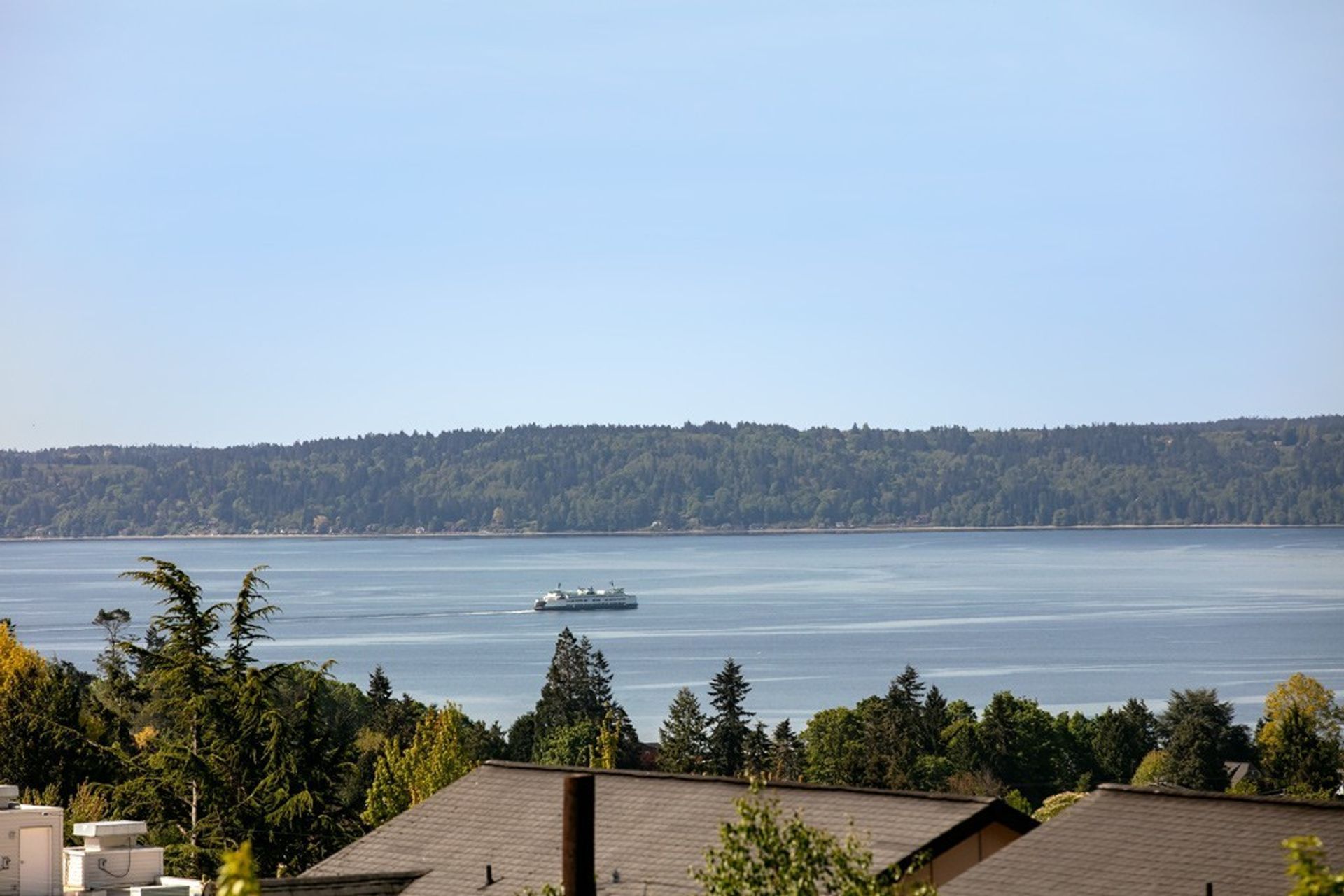 A large body of water with a boat in the distance