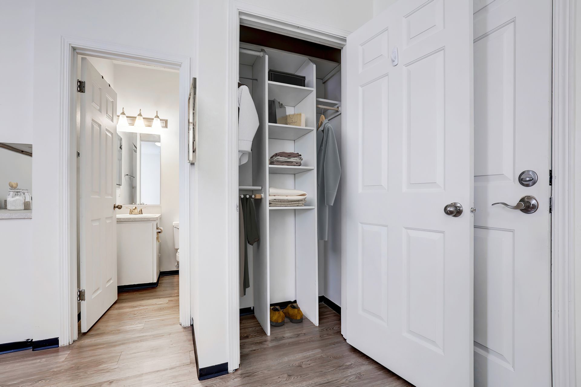 There is a walk in closet in the middle of the room.