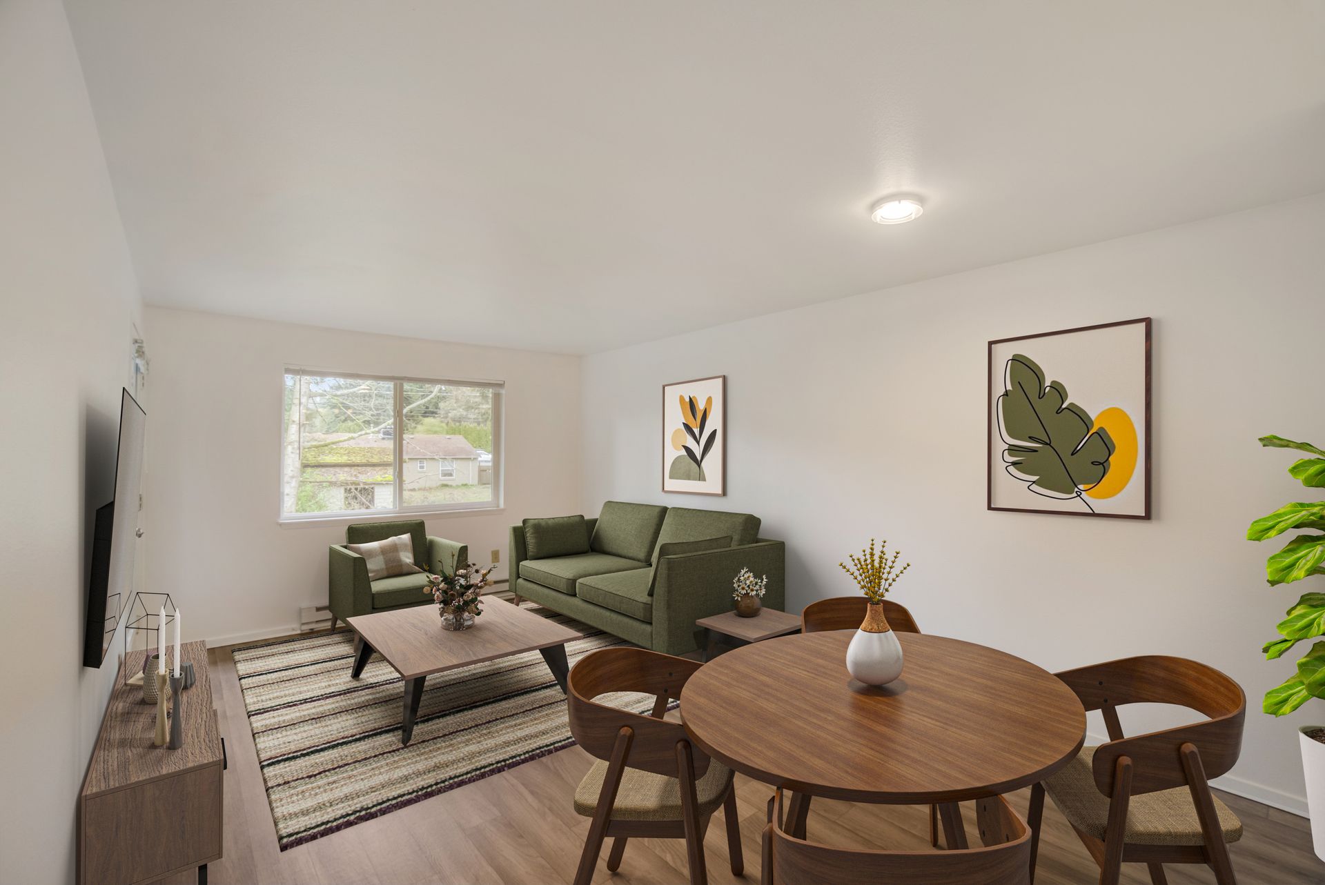 A living room with a couch , chairs , a table and a television.