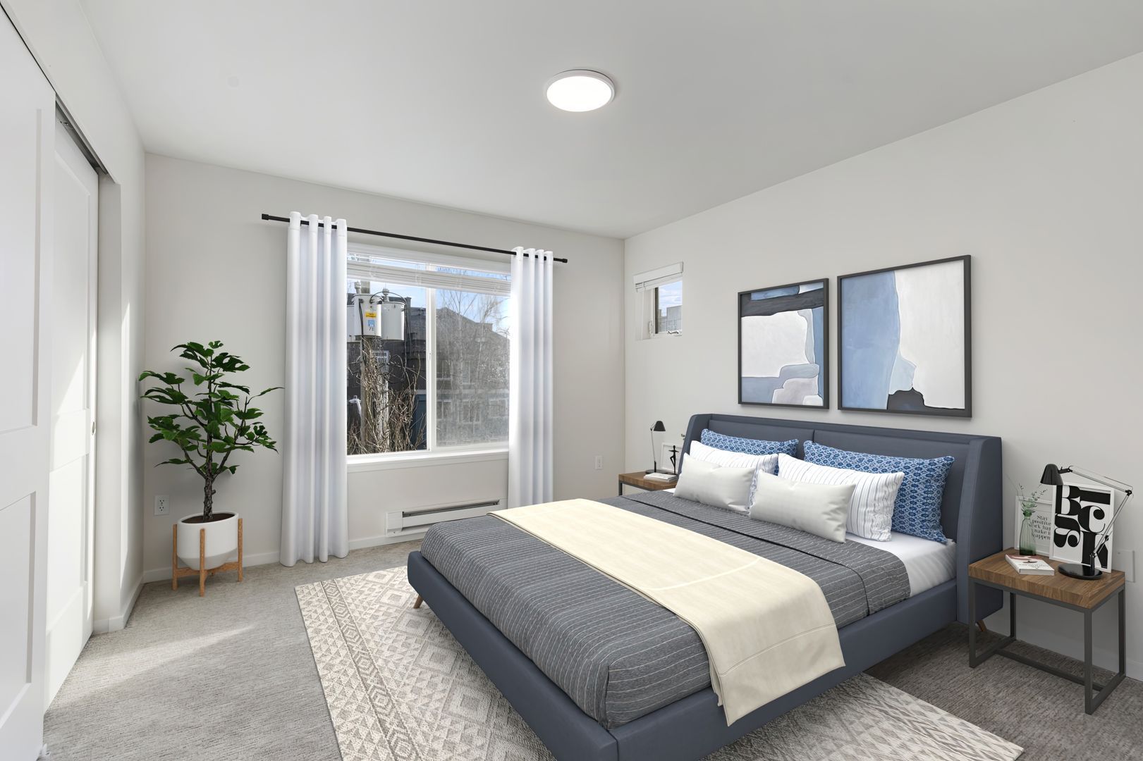 A bedroom with a large bed and a window.