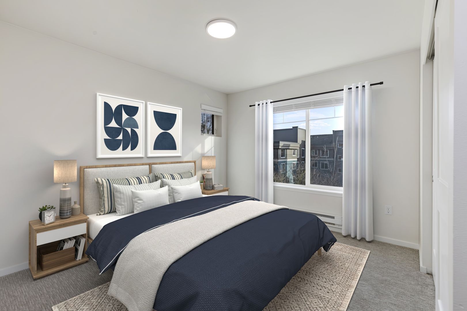 A bedroom with a large bed and a window.