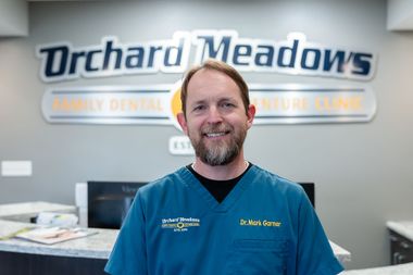 Dr. Garner standing in the Orchard Meadow’s Family Dental & Denture Clinic lobby.