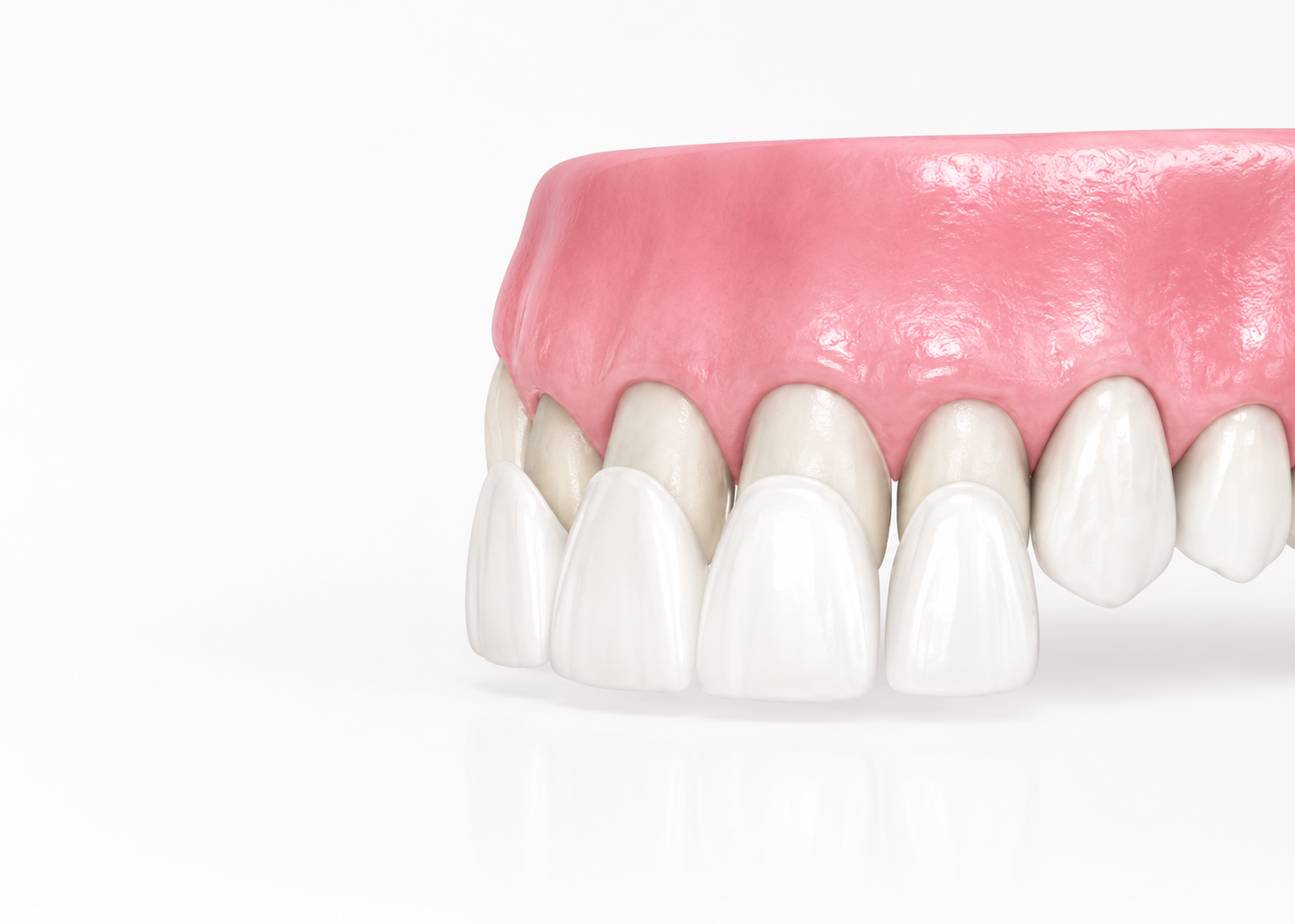 Close-up of white teeth with pink gums, showing a healthy smile detail