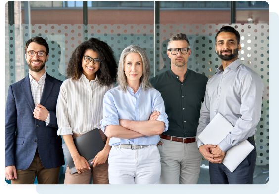 A diverse team of five professionals posing confidently indoors; a woman in the center has crossed arms.