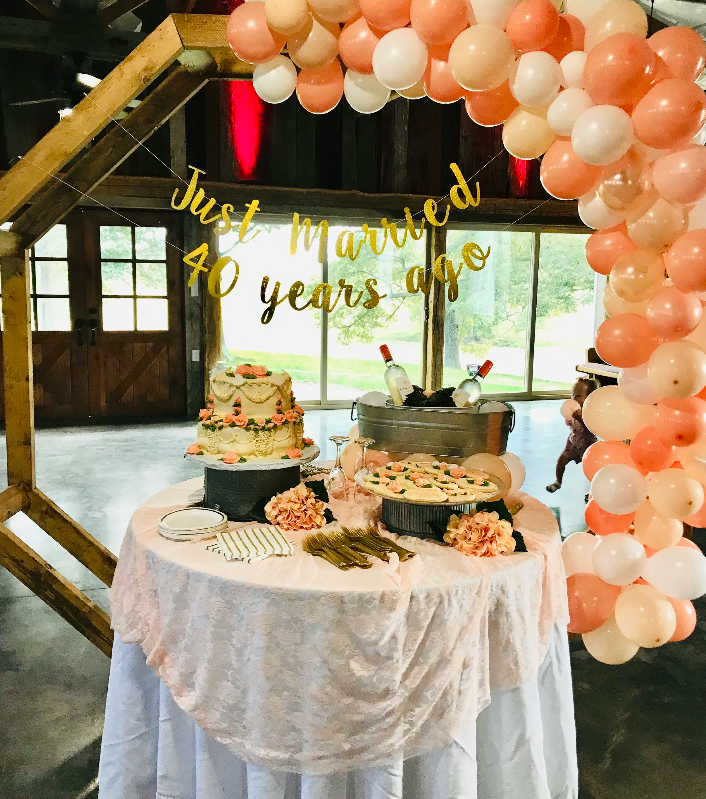 40th anniversary party balloon arch and cake