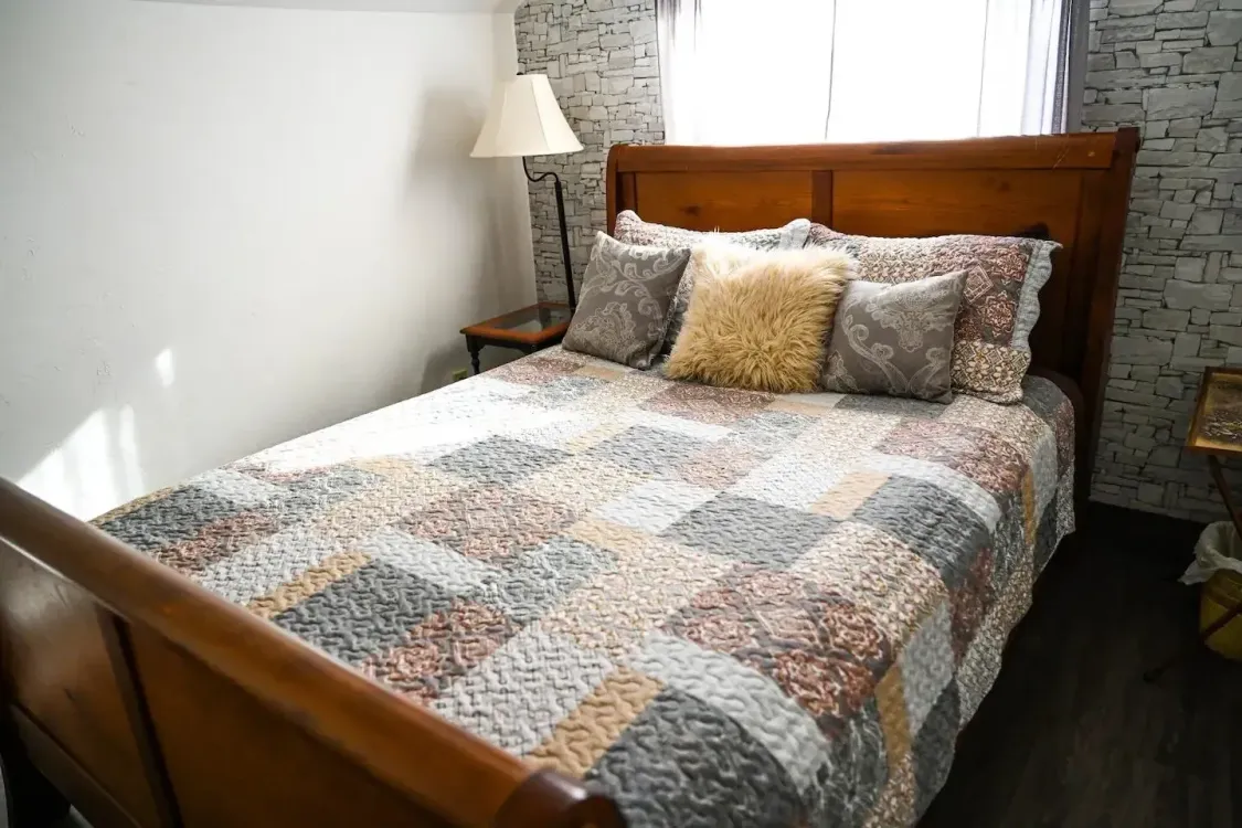 bed with rustic quilt