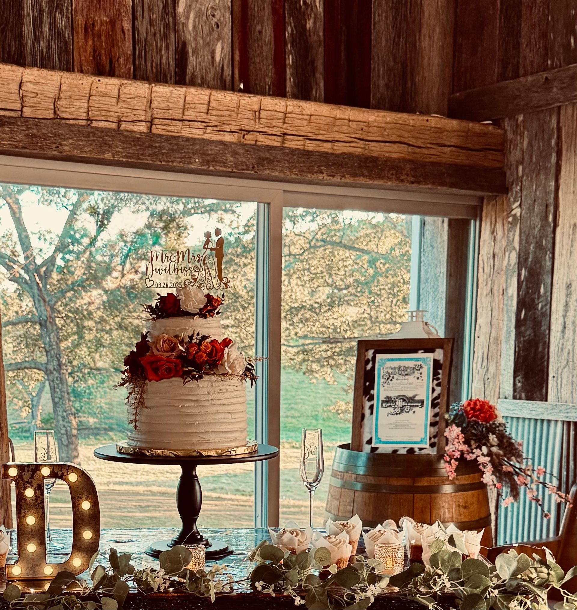 two tier wedding cake with rustic decor