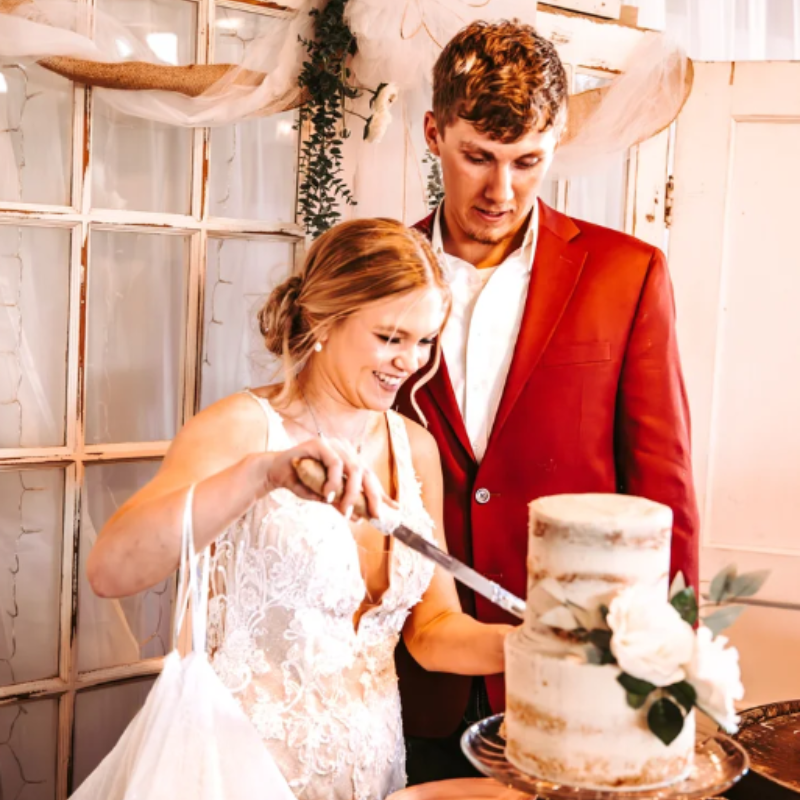 bride and groom cutting cake