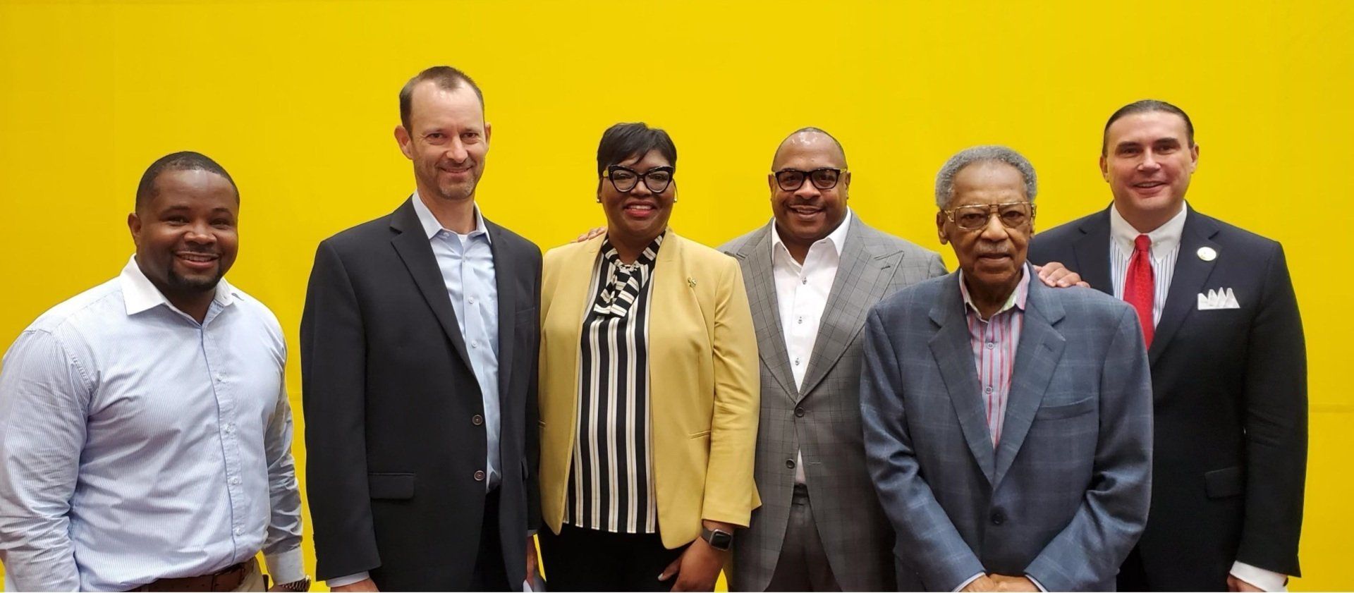 Rickey Whittington With His Team and Cardinals Owner
