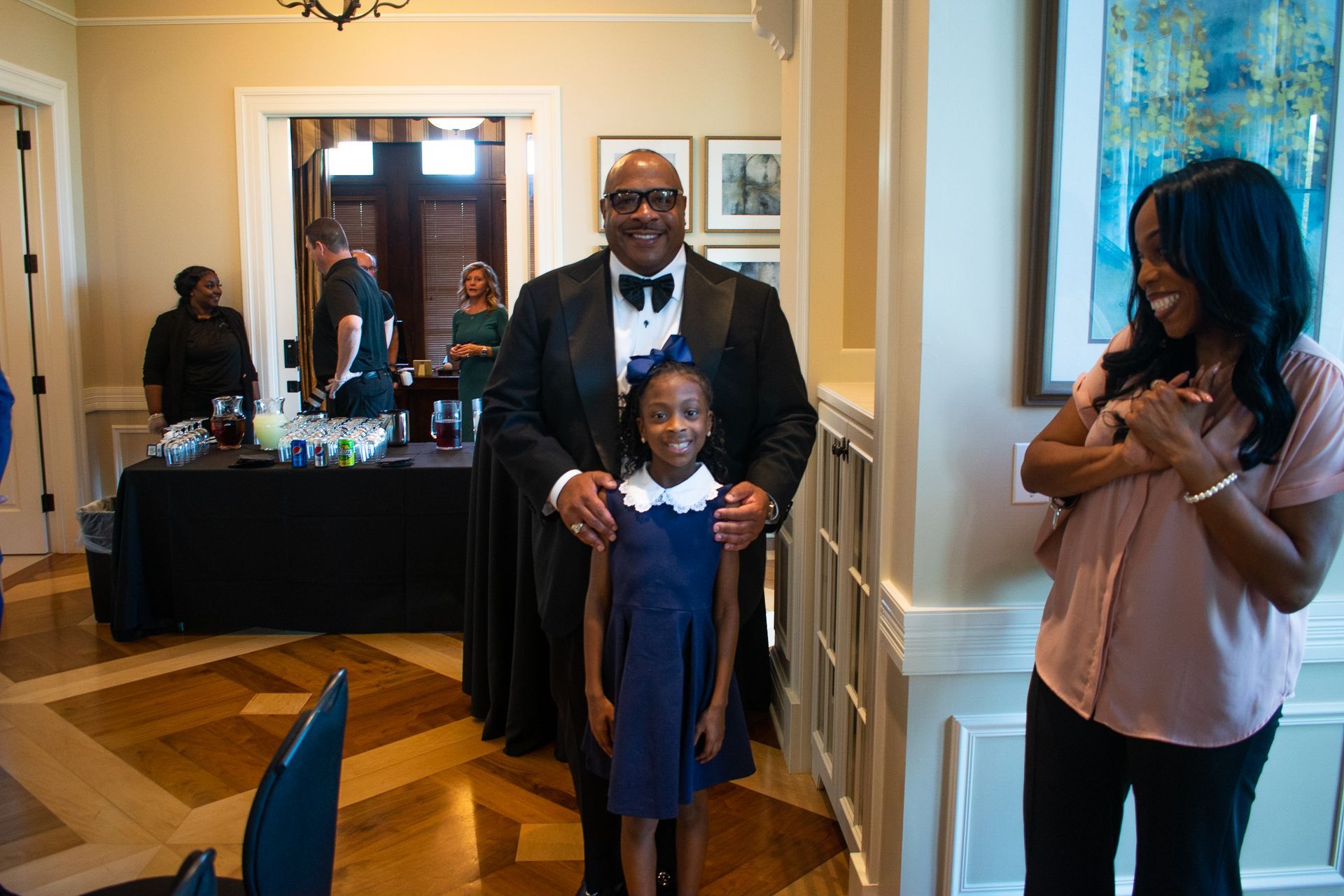 Rickey Whittington Taking a Picture With Little Girl